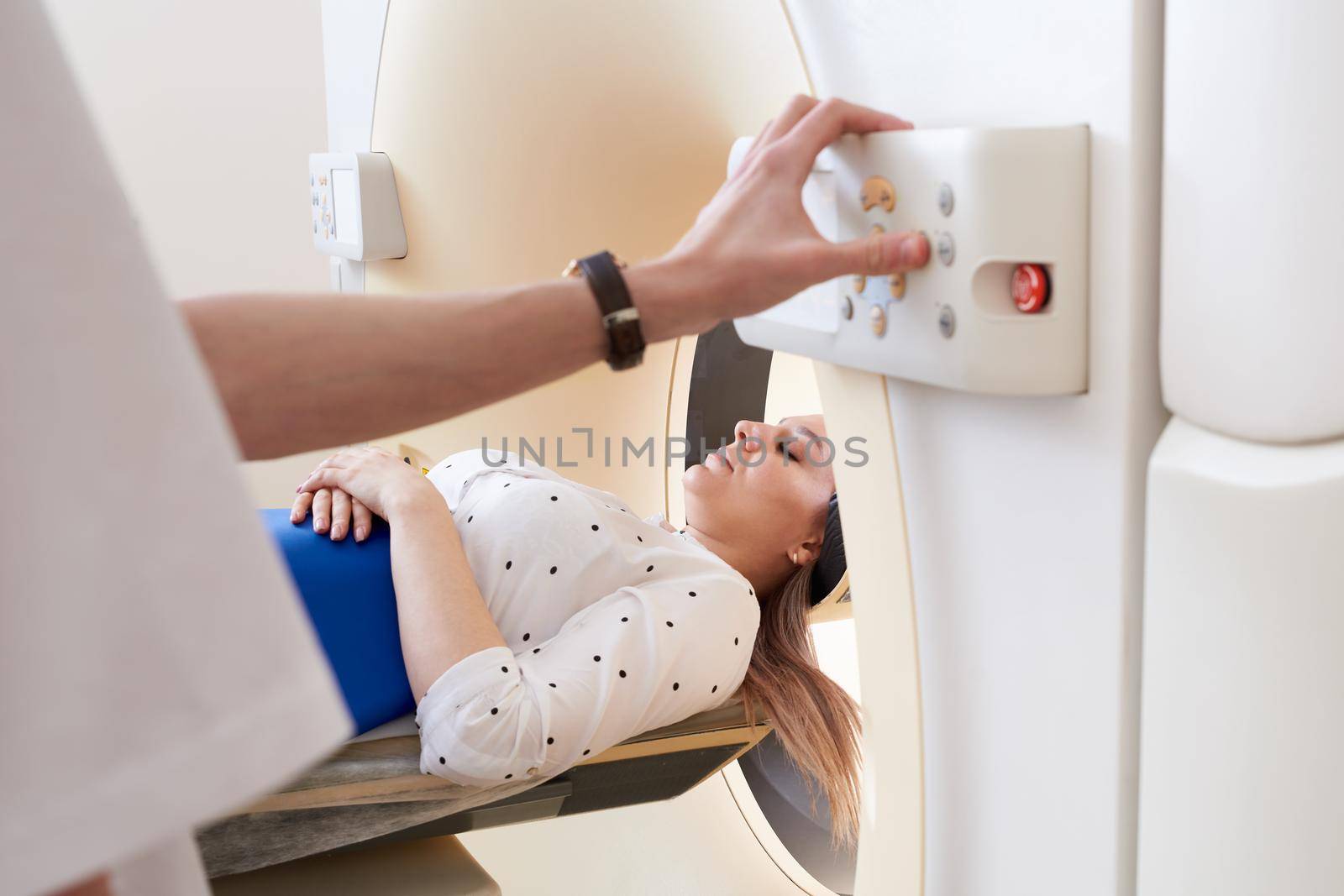 Female patient undergoing MRI - Magnetic resonance imaging in a Hospital. Medical Equipment and Health Care