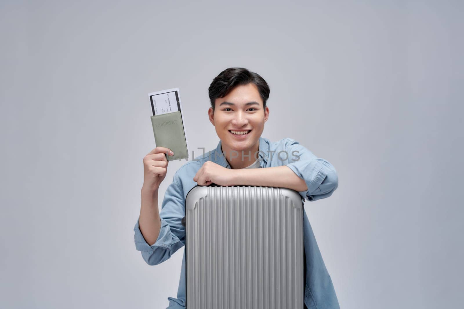 Traveler happy man hold suitcase passport isolated on white background  by makidotvn