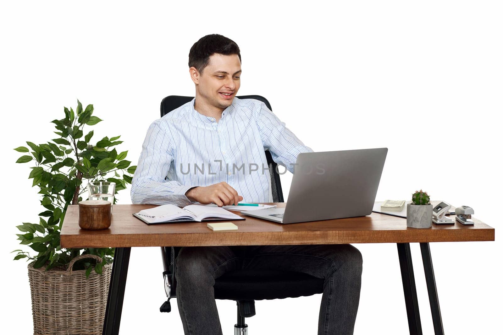 young friendly Freelancer man talking on video call to client, sitting on chair at desk, using laptop