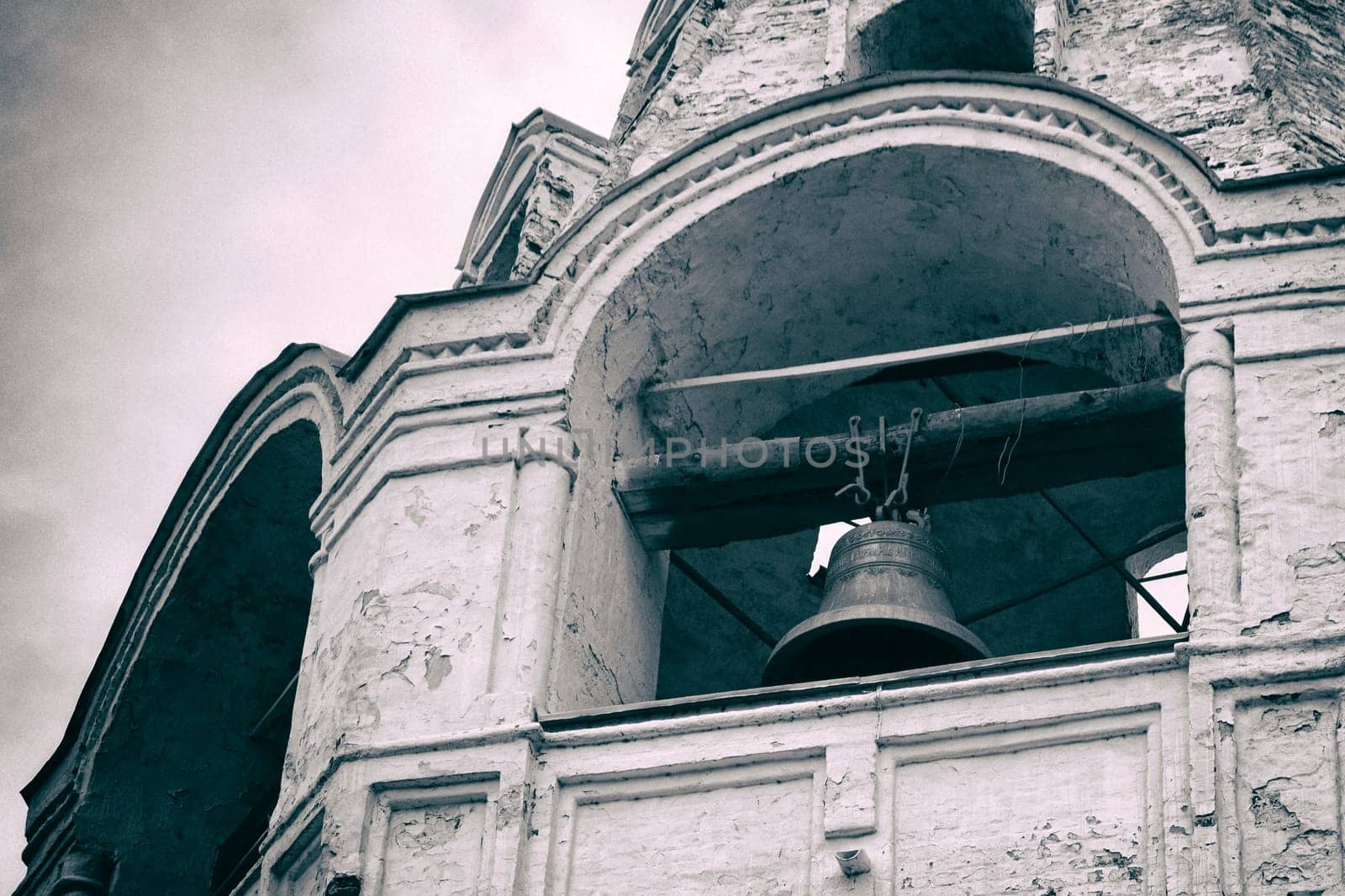 Bell in an old bell tower. Vintage film effect added