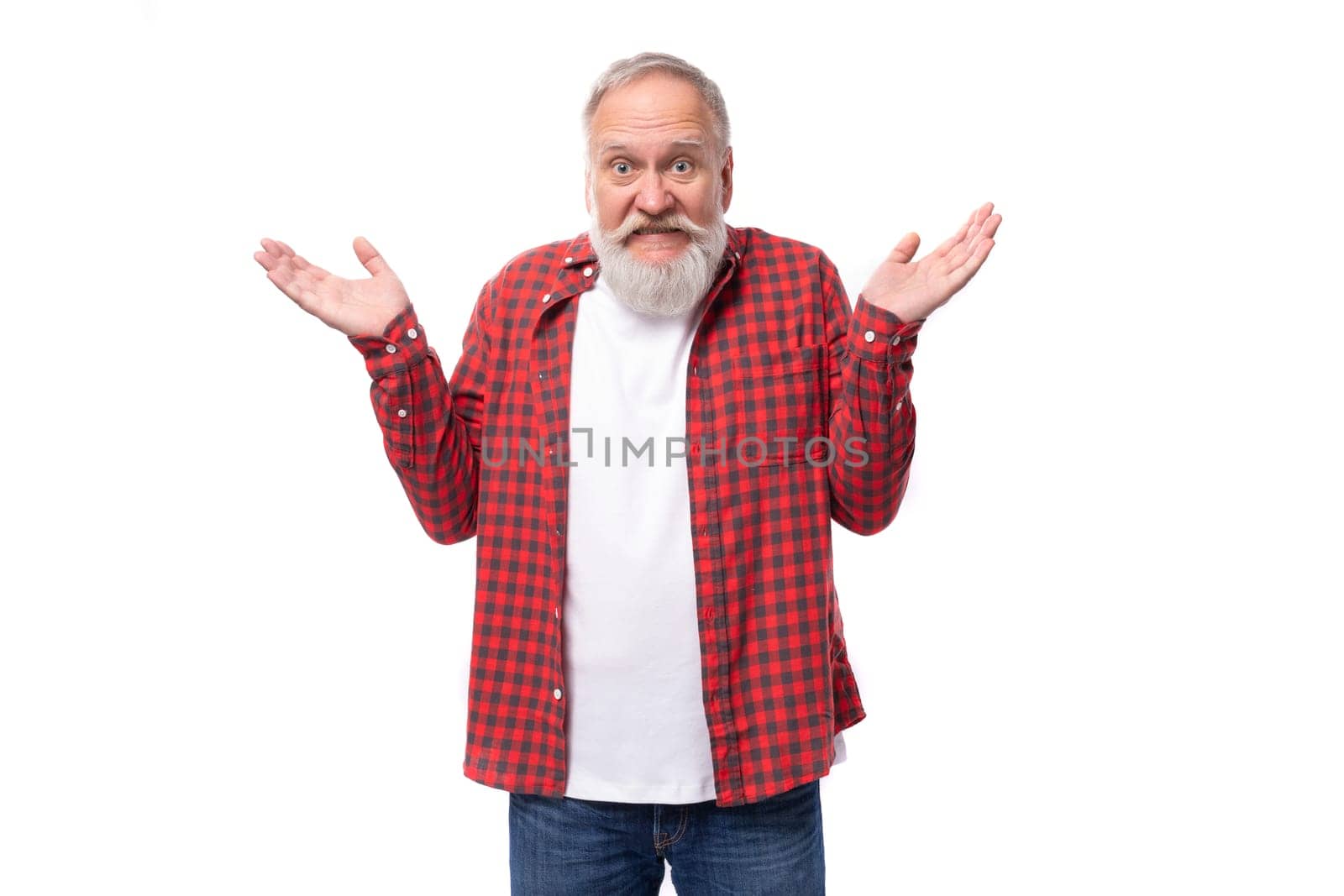 handsome 60s retired man with white beard and mustache throws up his hands.