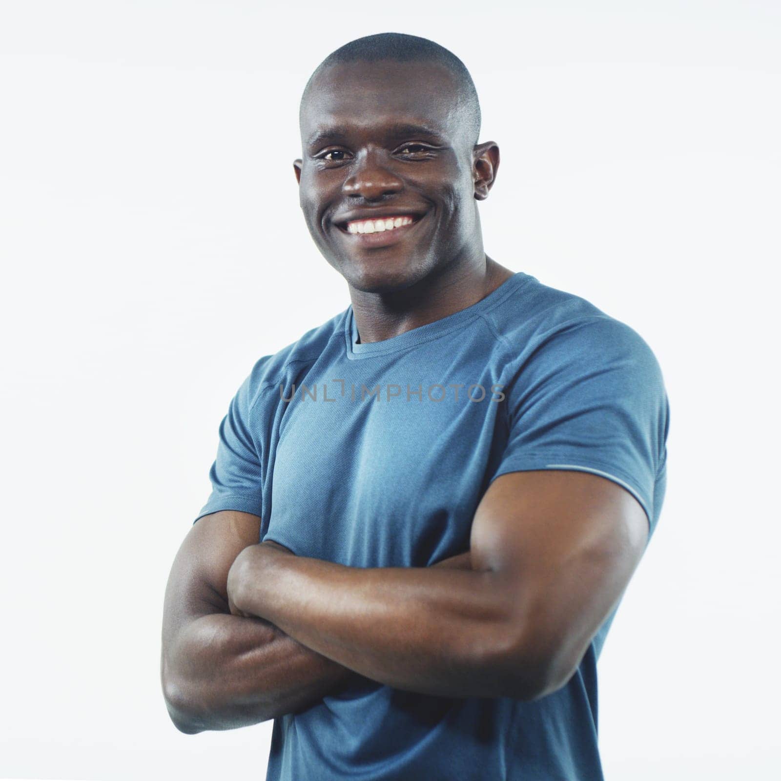 Black man, smile and portrait with strong arms crossed and confidence in a studio. White background, African male person and happy model face with pride, active style and fitness fashion isolated.