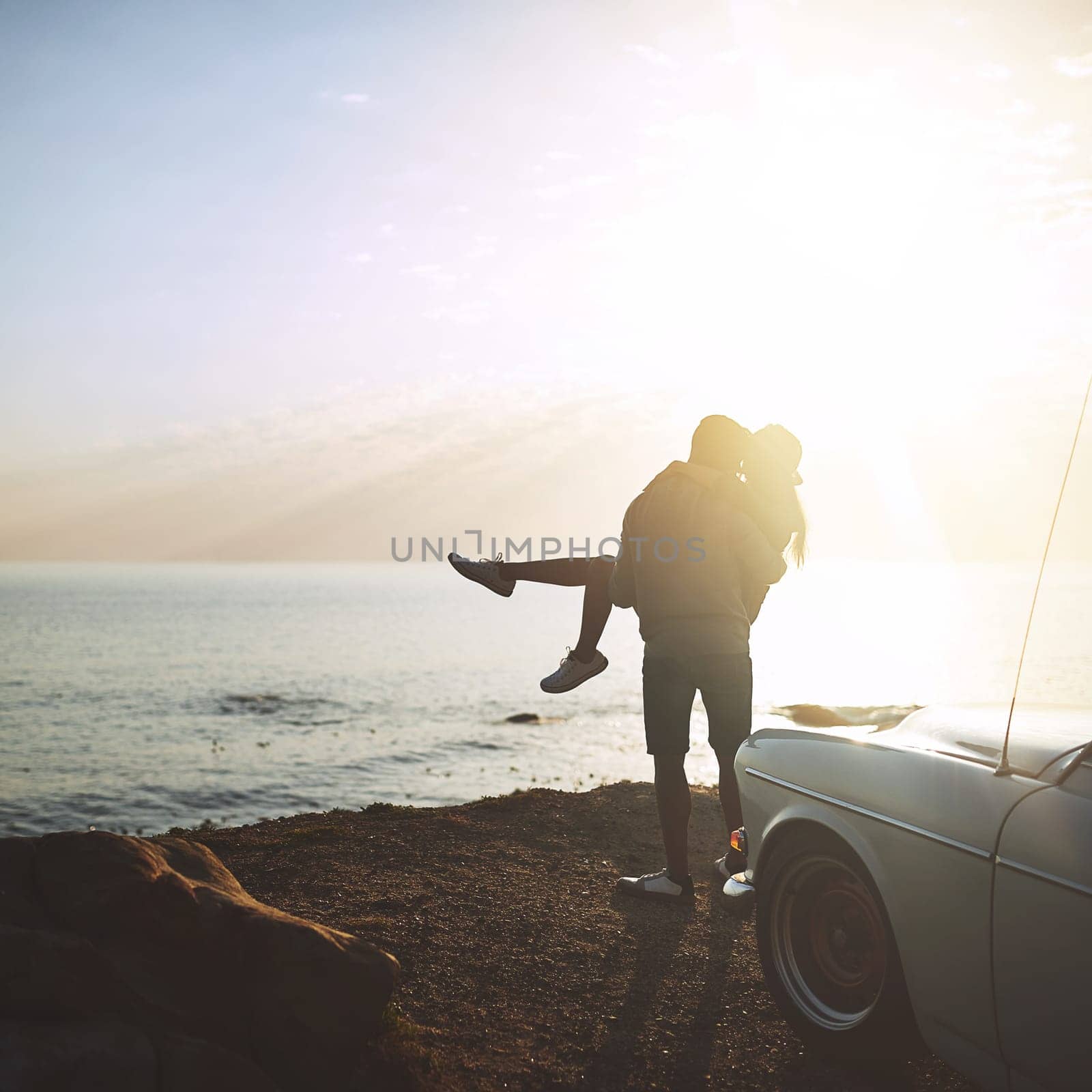 And this is how our honeymoon starts. a young couple making a stop at the beach while out on a road trip