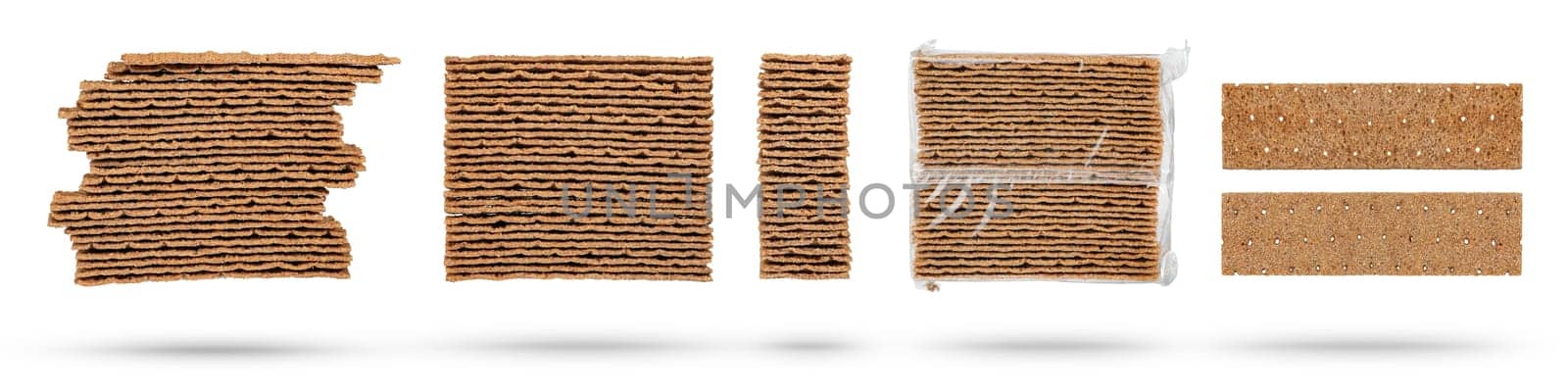 Set of different rye chips on a white background. The chips are stacked one on top of the other, close-up side view. A set of dried bread slices for sandwiches