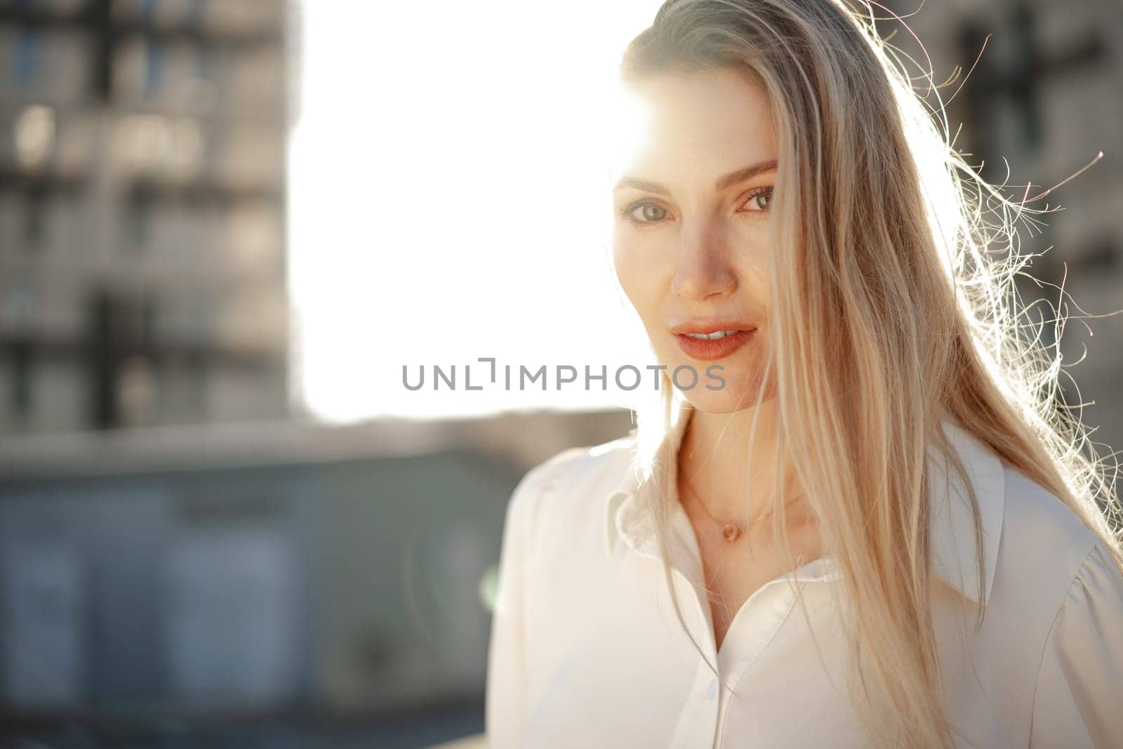 Close up portrait of young blonde businesswoman outdoors