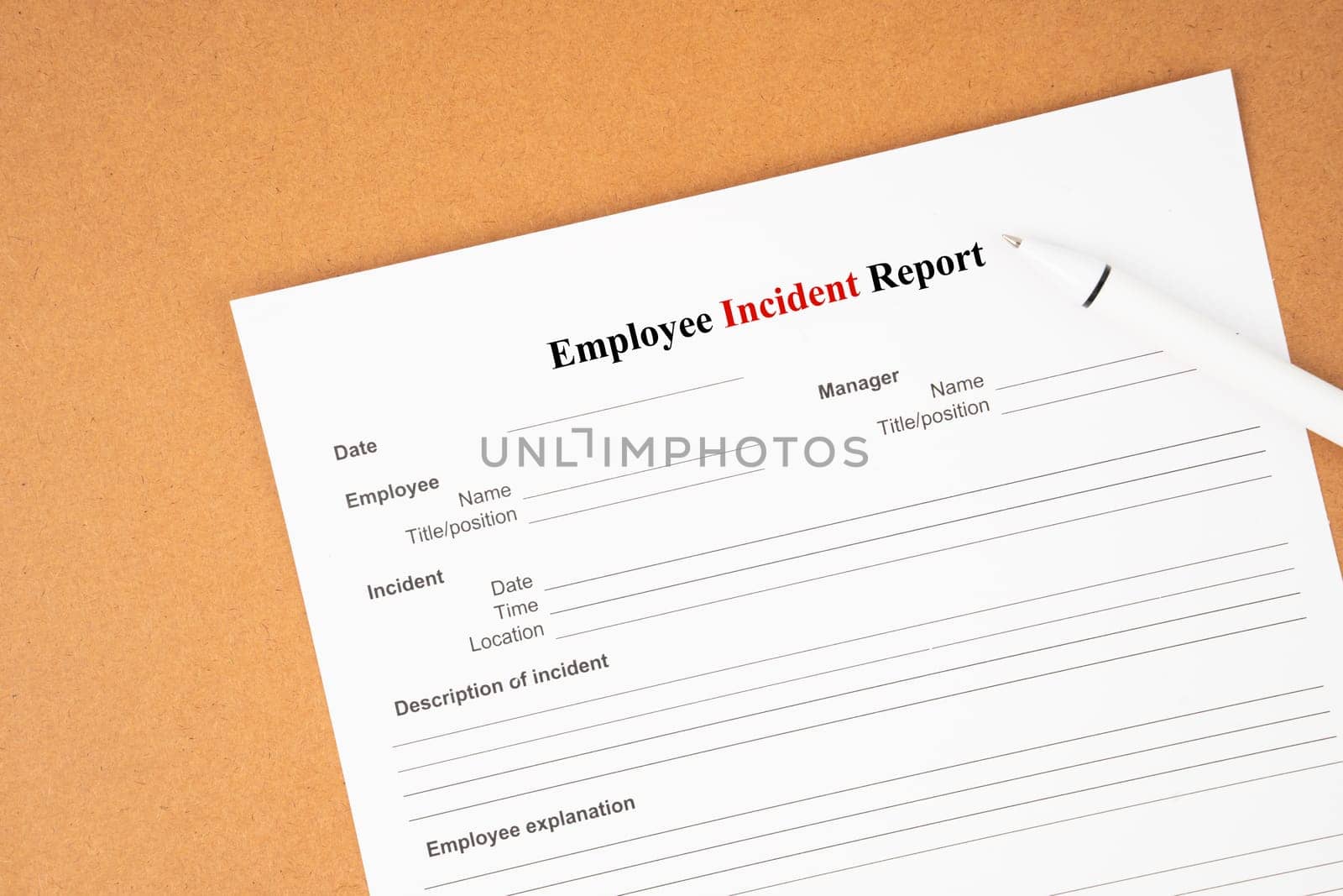 Employee incident report form document and and pen on blue background.