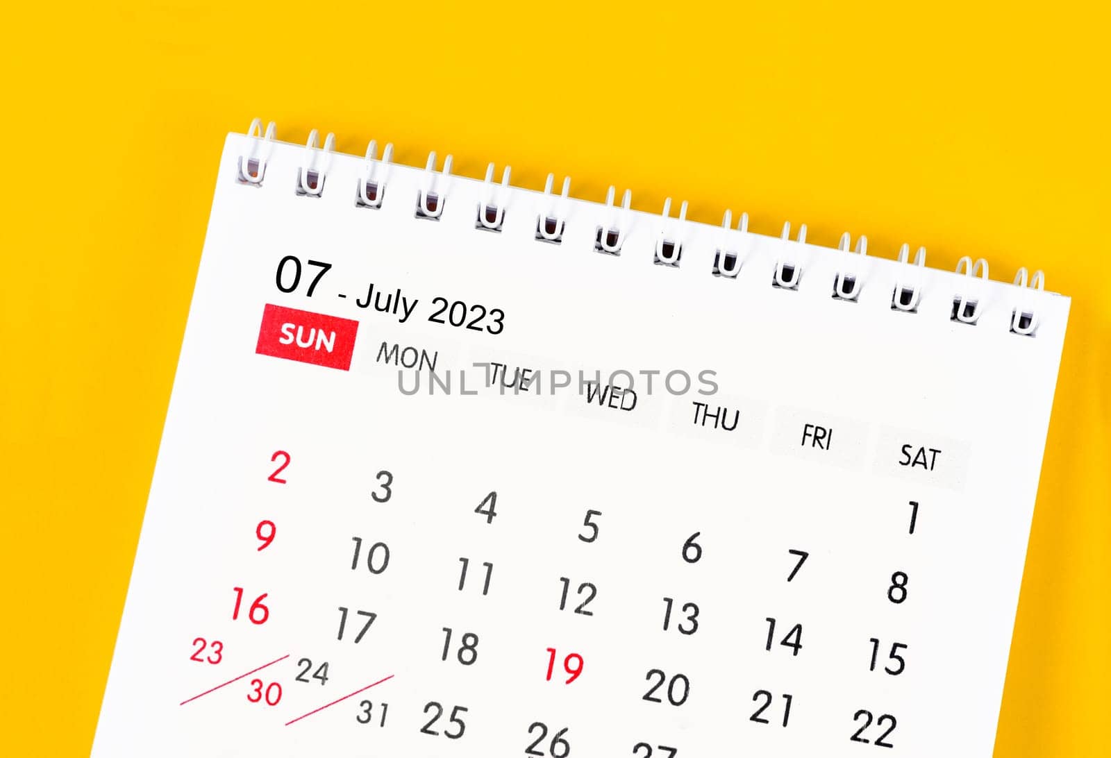 July 2023 Monthly desk calendar for 2023 year on yellow color background.