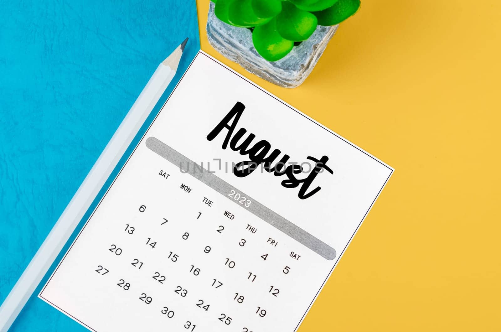 The August 2023 Monthly calendar for 2023 year with pencil on beautiful background. by Gamjai