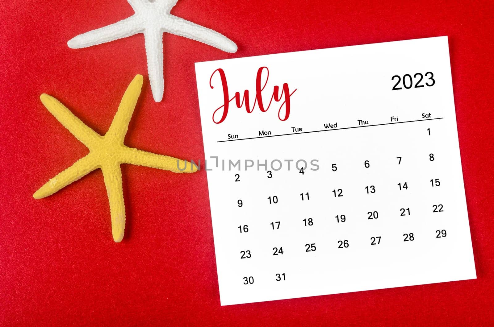 The July 2023 Monthly calendar with Starfish on red background. by Gamjai