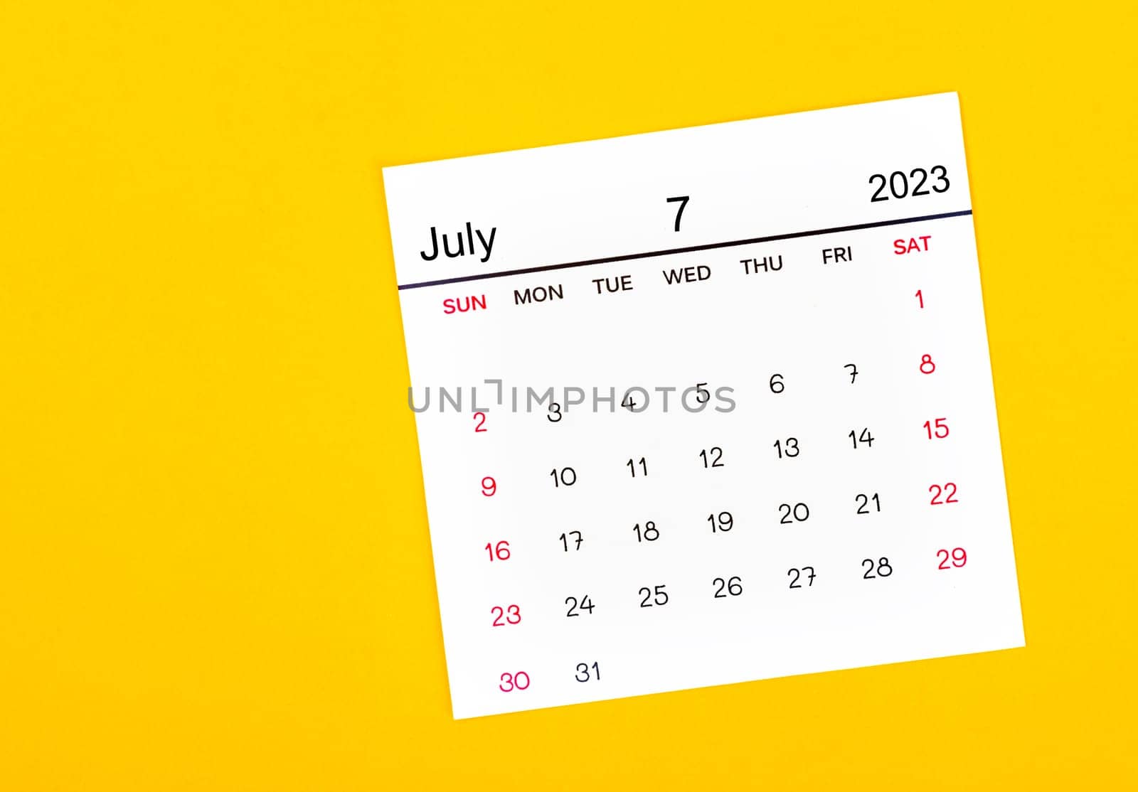 The July 2023 Monthly calendar for 2023 year on yellow background. by Gamjai