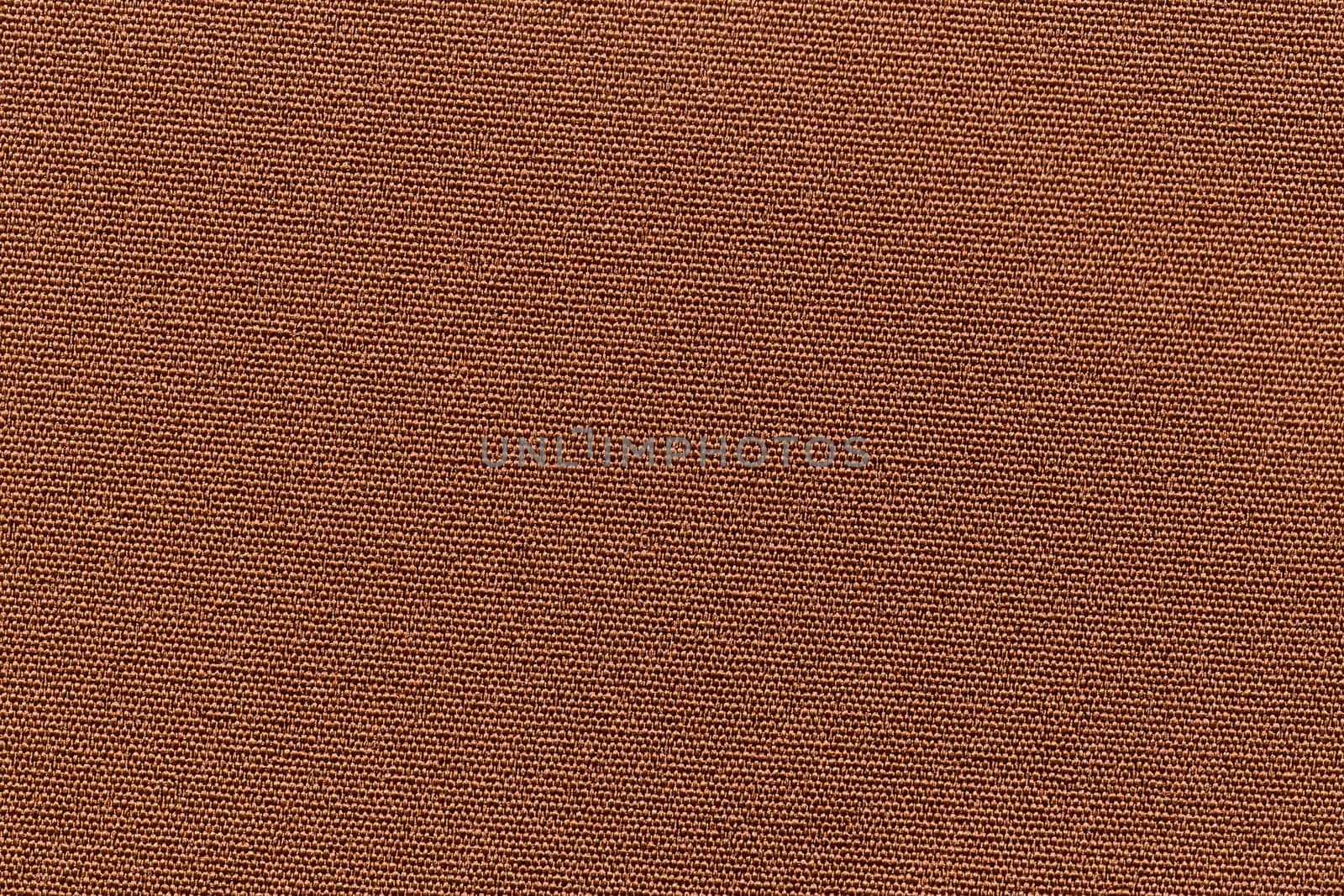 The brown fabric texture for background. Abstract background by Gamjai