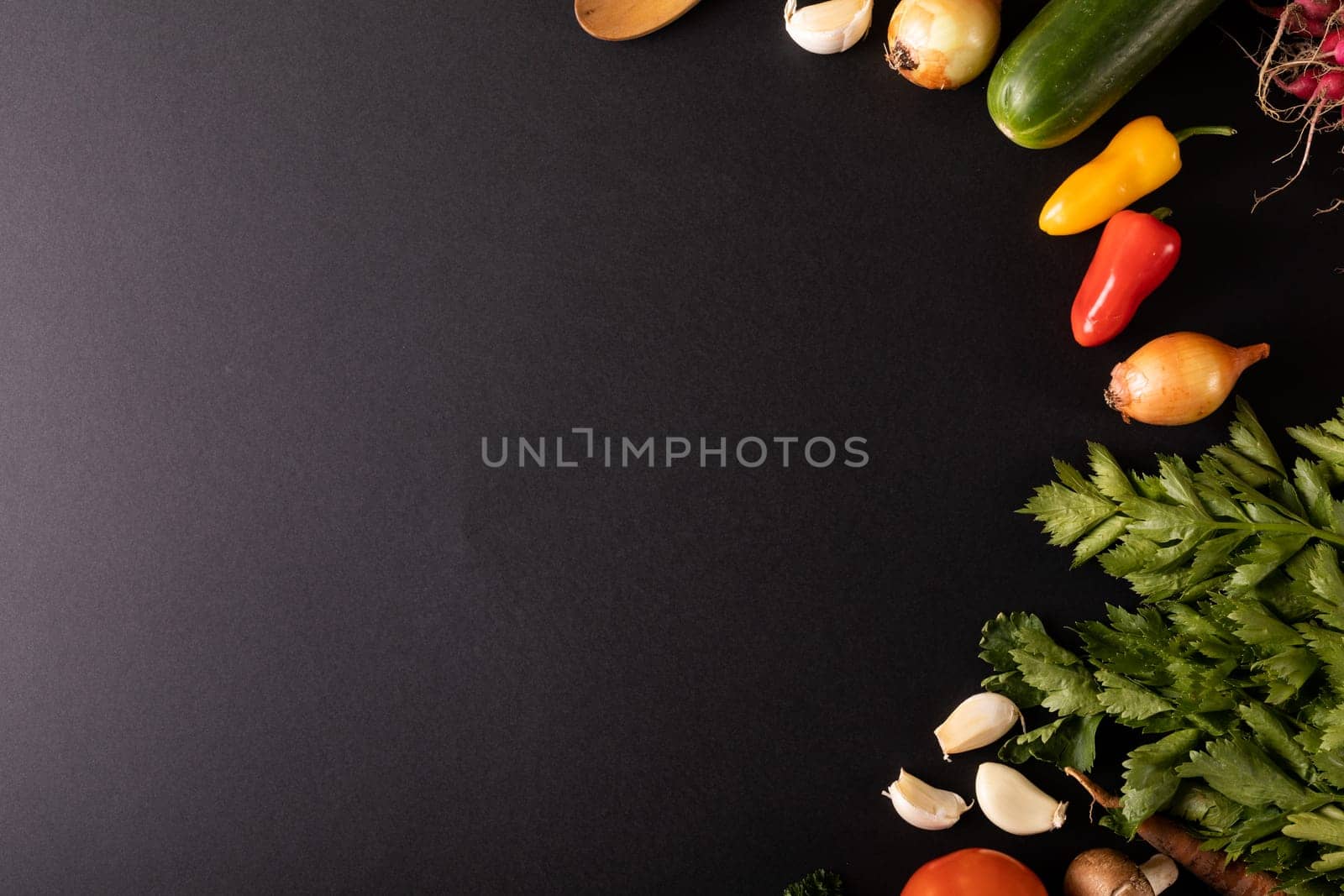 Directly above shot of fresh food on black background with copy space by Wavebreakmedia