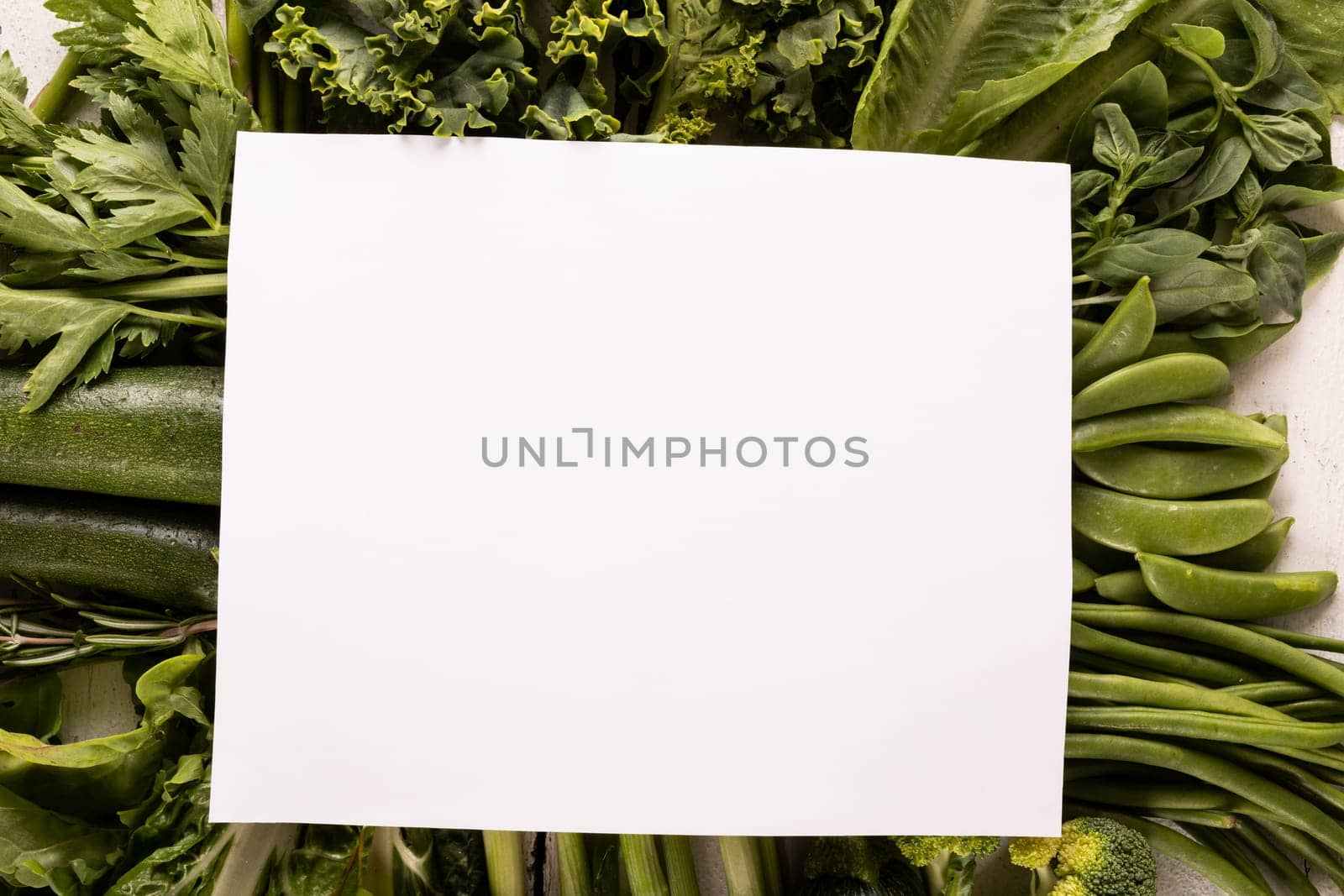 Overhead view of fresh green vegetables on table with copy space. unaltered, food, advertisement, healthy eating, organic.