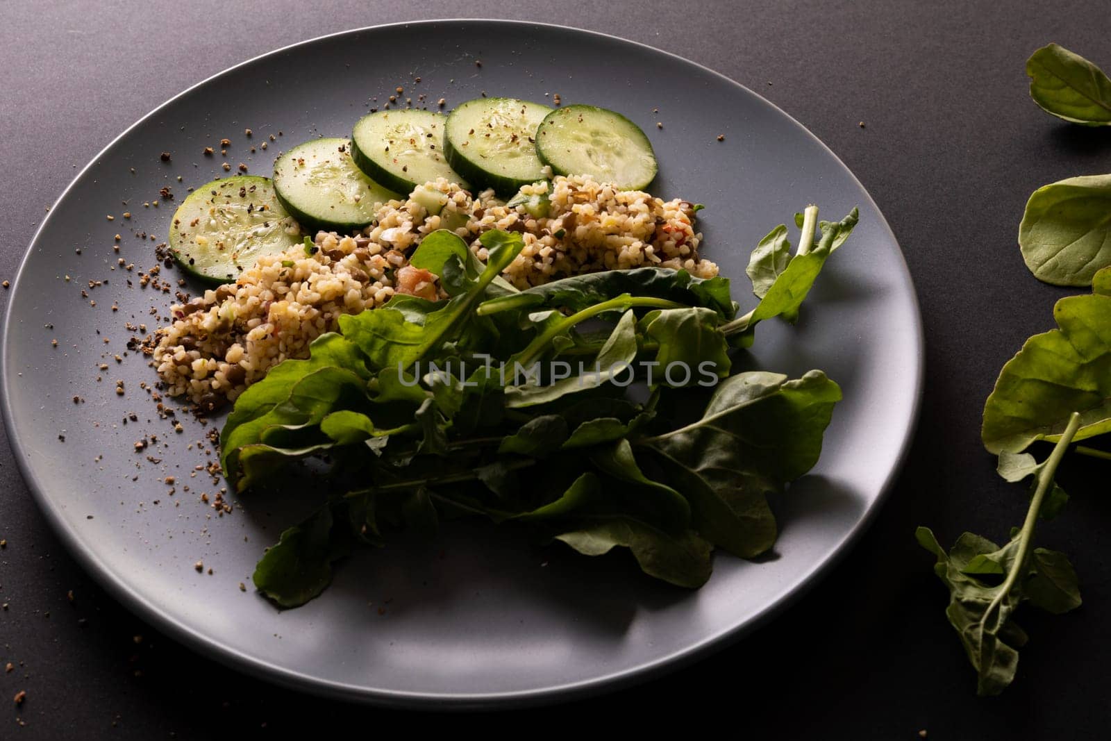 Close-up of fresh healthy food in plate on black background, copy space. unaltered, food, studio shot, healthy eating, organic.