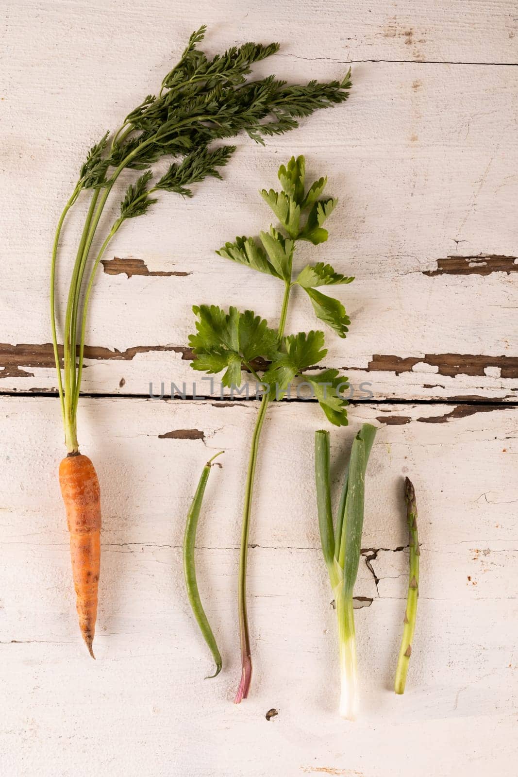 Overhead view of fresh vegetables on white table, copy space by Wavebreakmedia