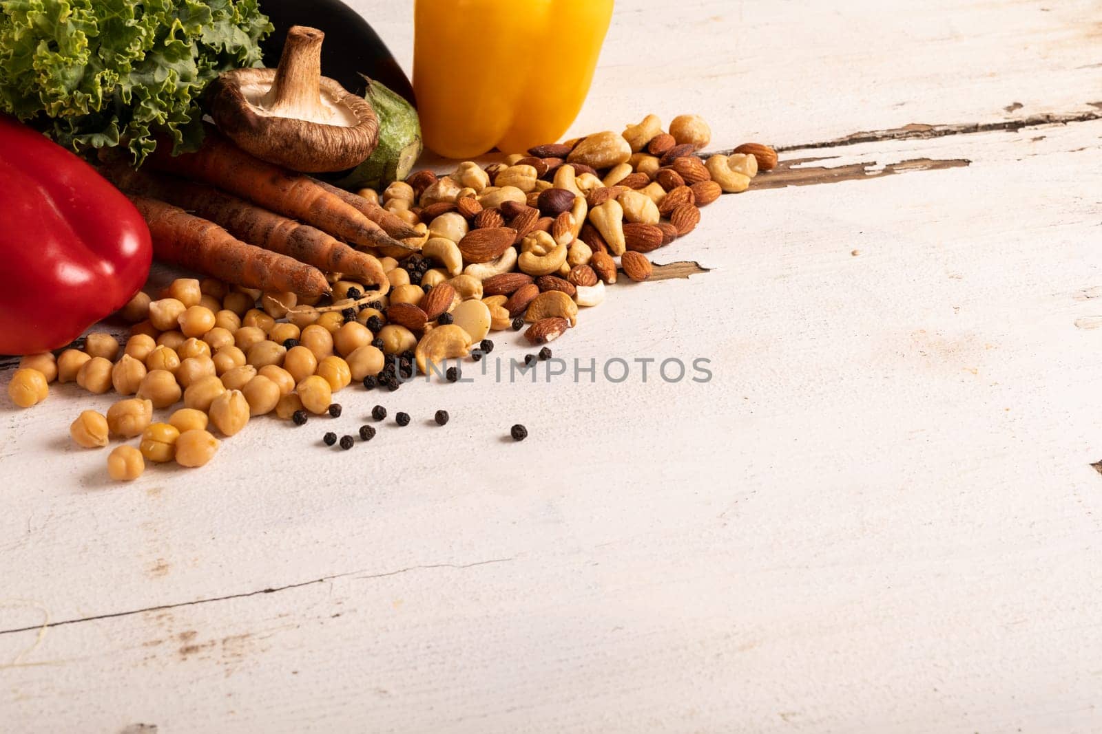 Close-up of various healthy food and ingredients on white table, copy space by Wavebreakmedia