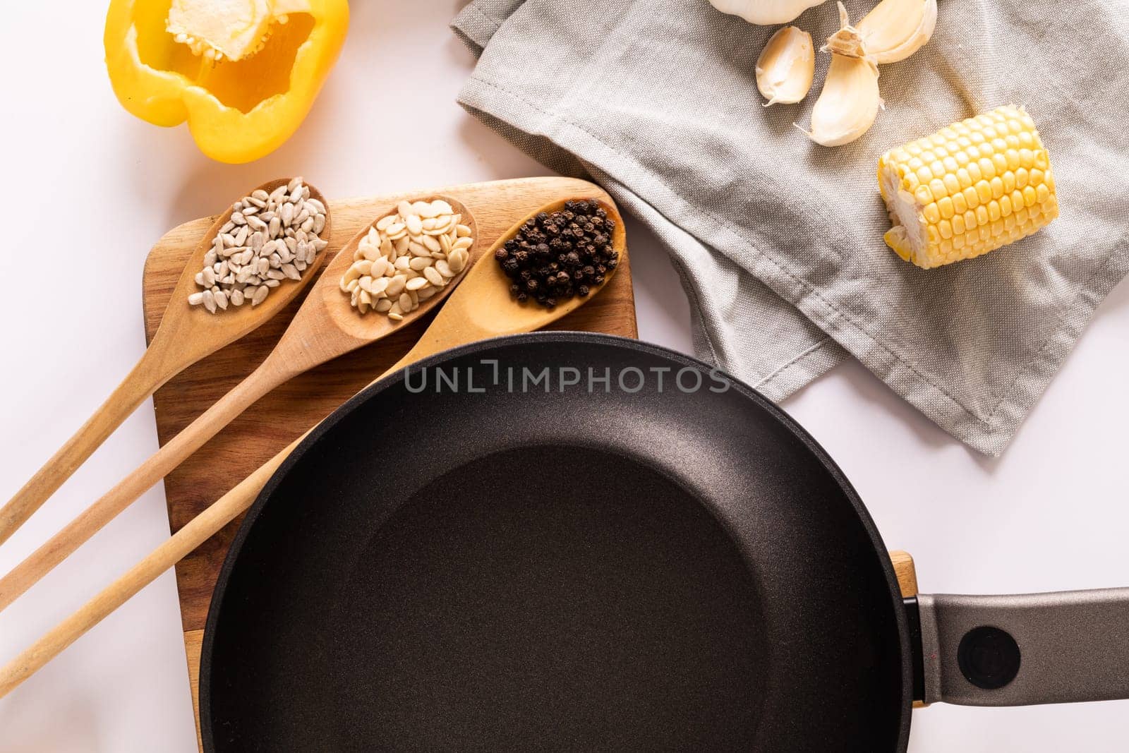 Overhead view of various ingredients with cooking pan on table, copy space by Wavebreakmedia