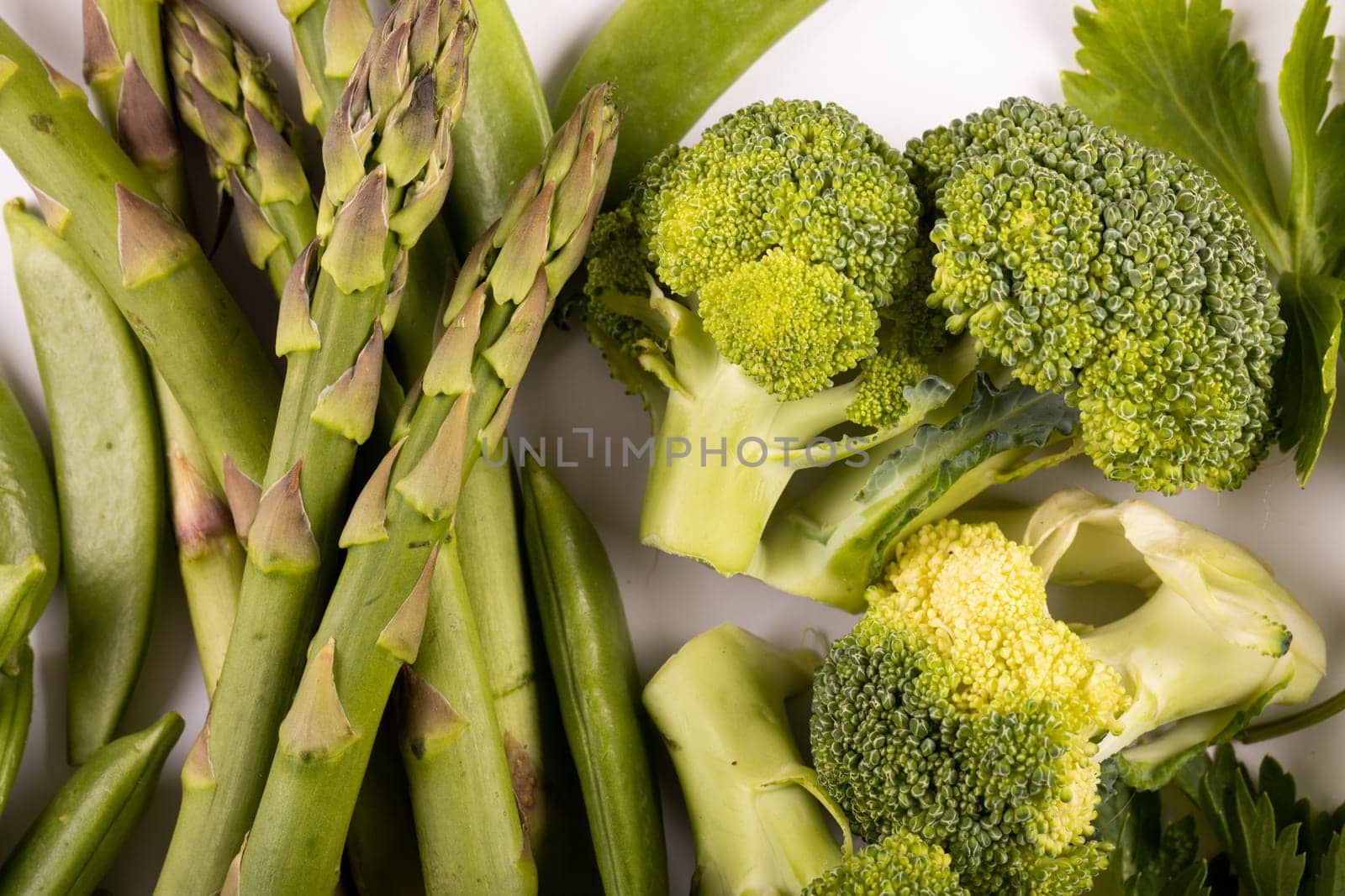 Full frame shot of various fresh organic vegetables on white background, copy space by Wavebreakmedia
