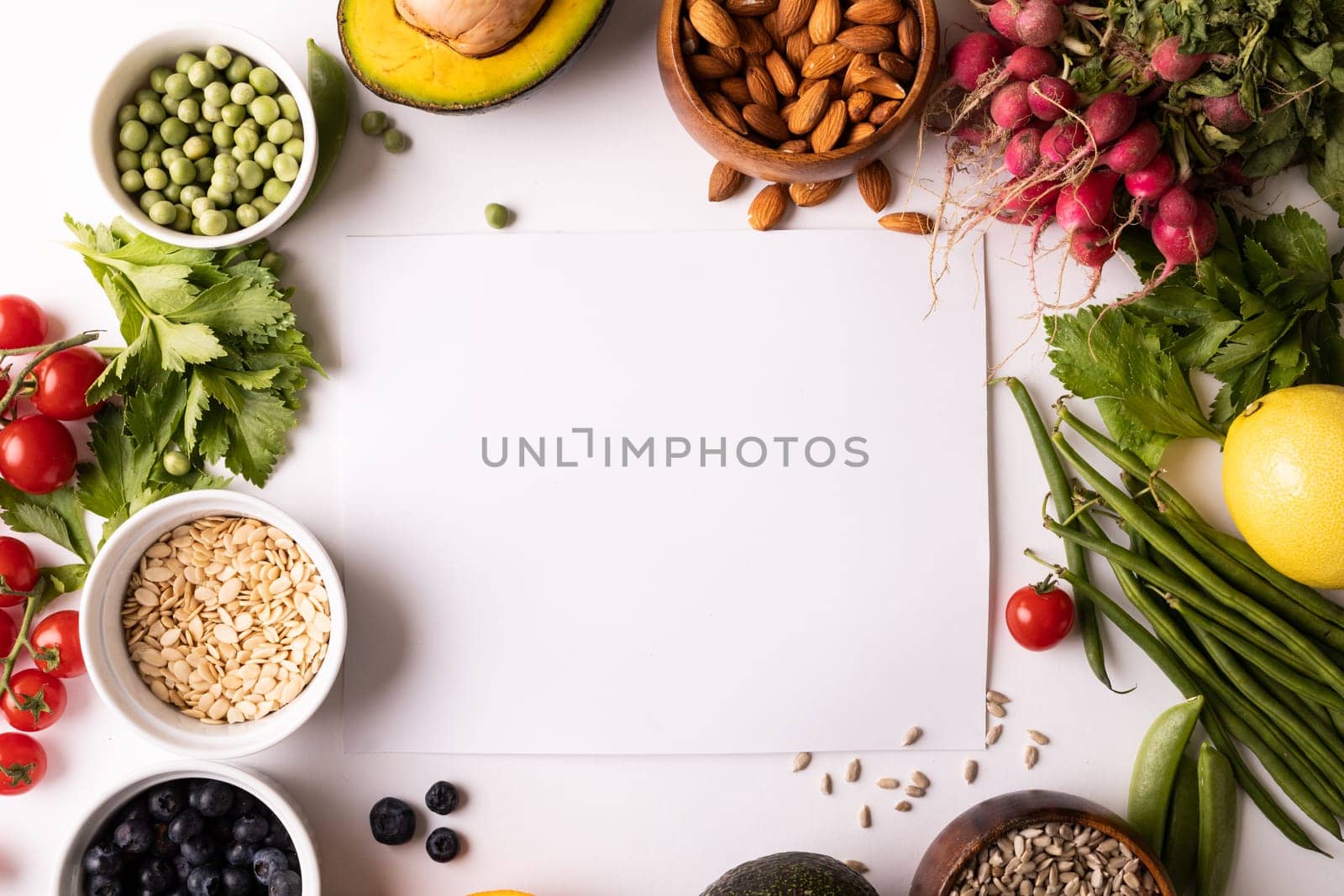 Overhead view of copy space amidst various fresh food on white background. unaltered, food, healthy eating, organic concept.