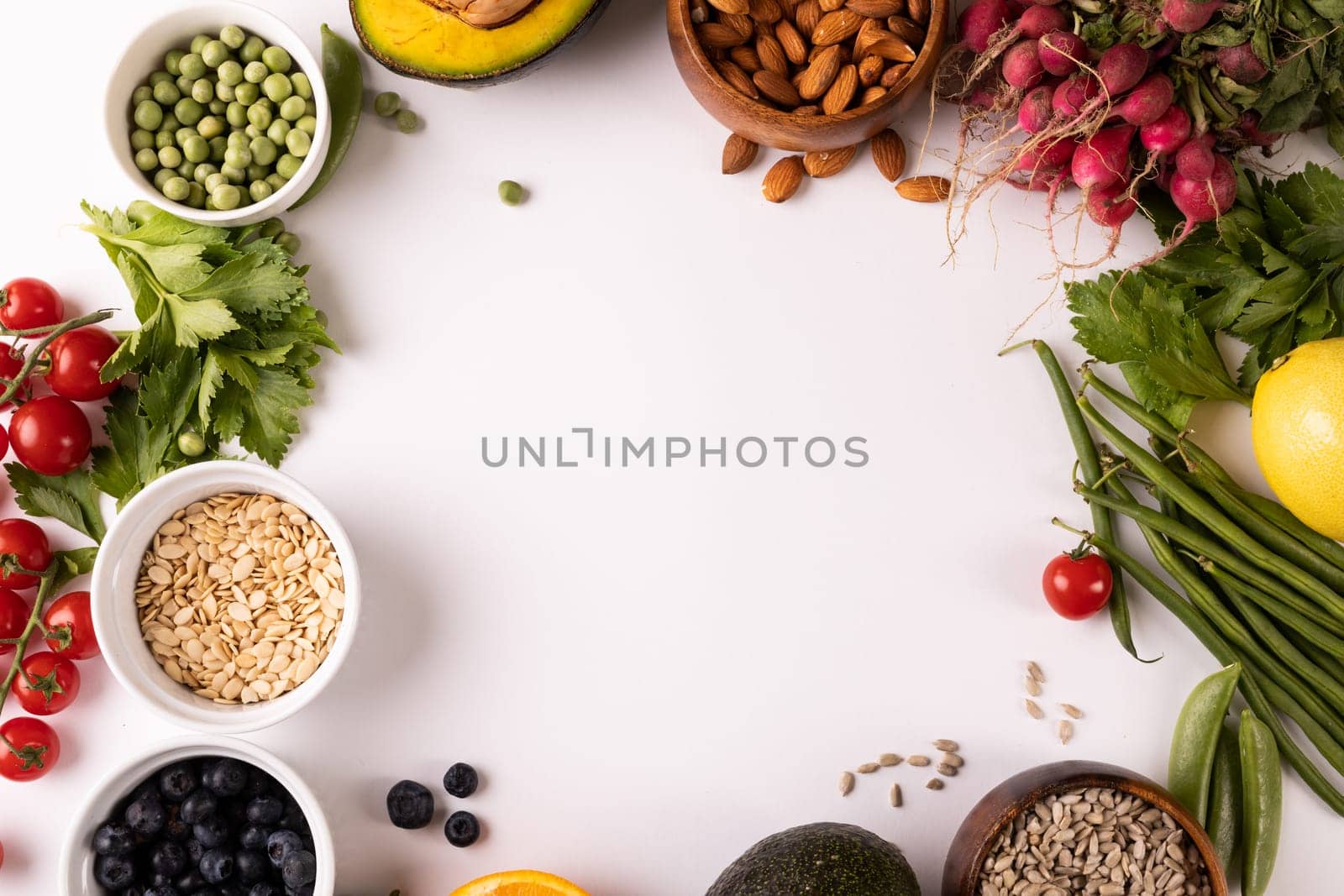 Directly above view of copy space surrounded by various fresh food on white background. unaltered, food, healthy eating, organic concept.