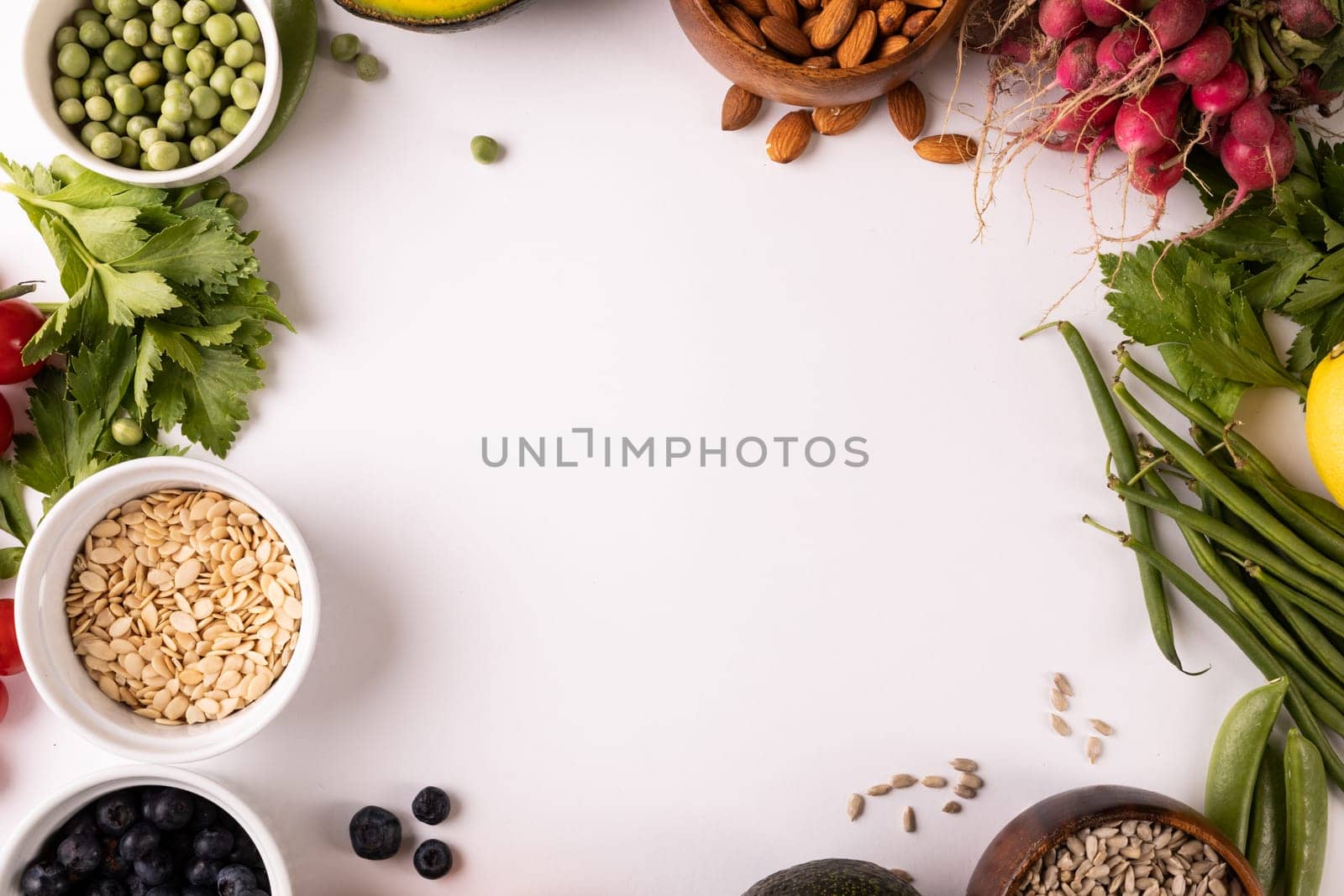 Directly above view of copy space amidst various fresh food on white background by Wavebreakmedia