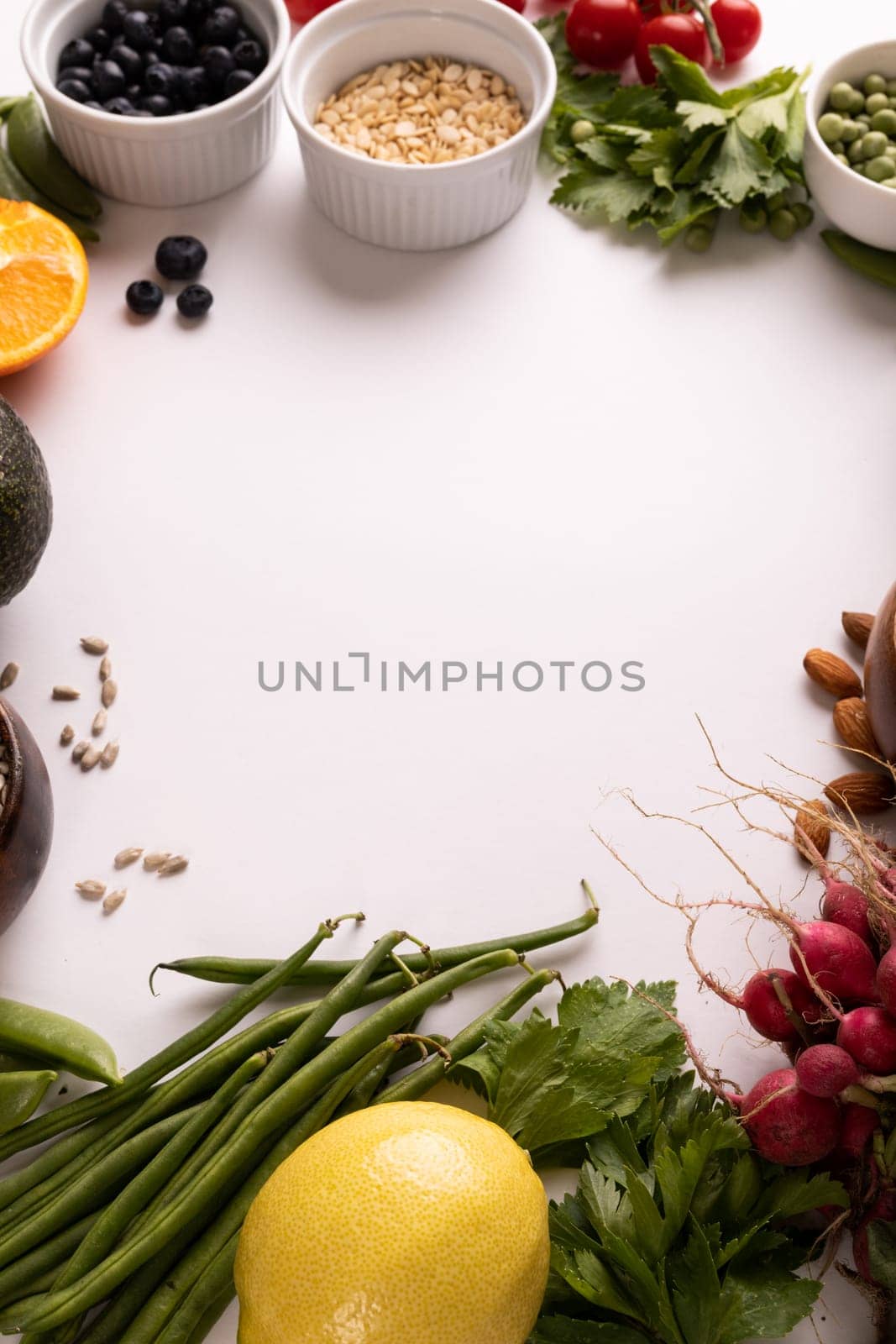 High angle view of copy space amidst various fresh food on white background. unaltered, food, healthy eating, organic concept.