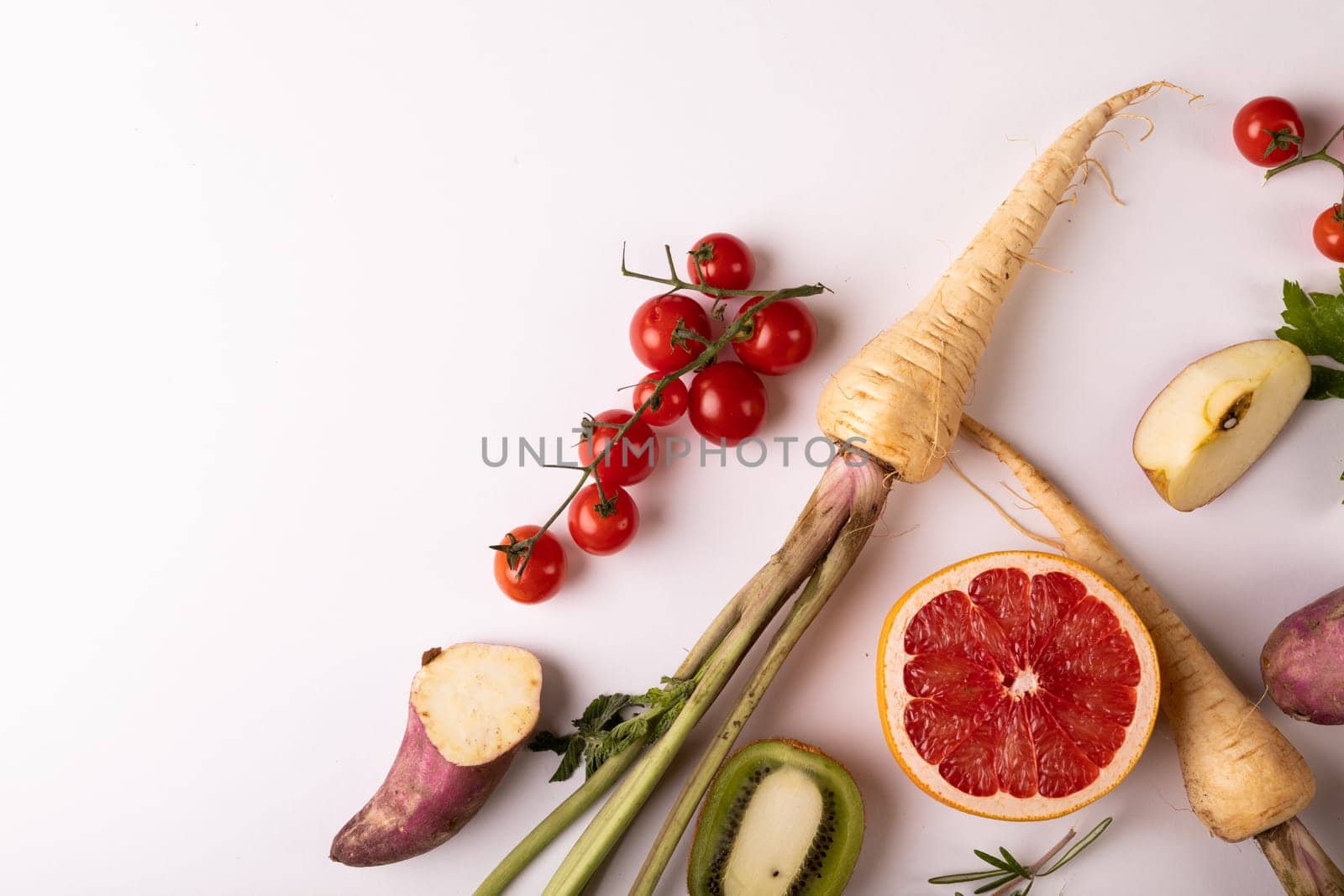 Directly above view of fresh vegetables and fruits by copy space on white background. unaltered, food, healthy eating, organic concept.