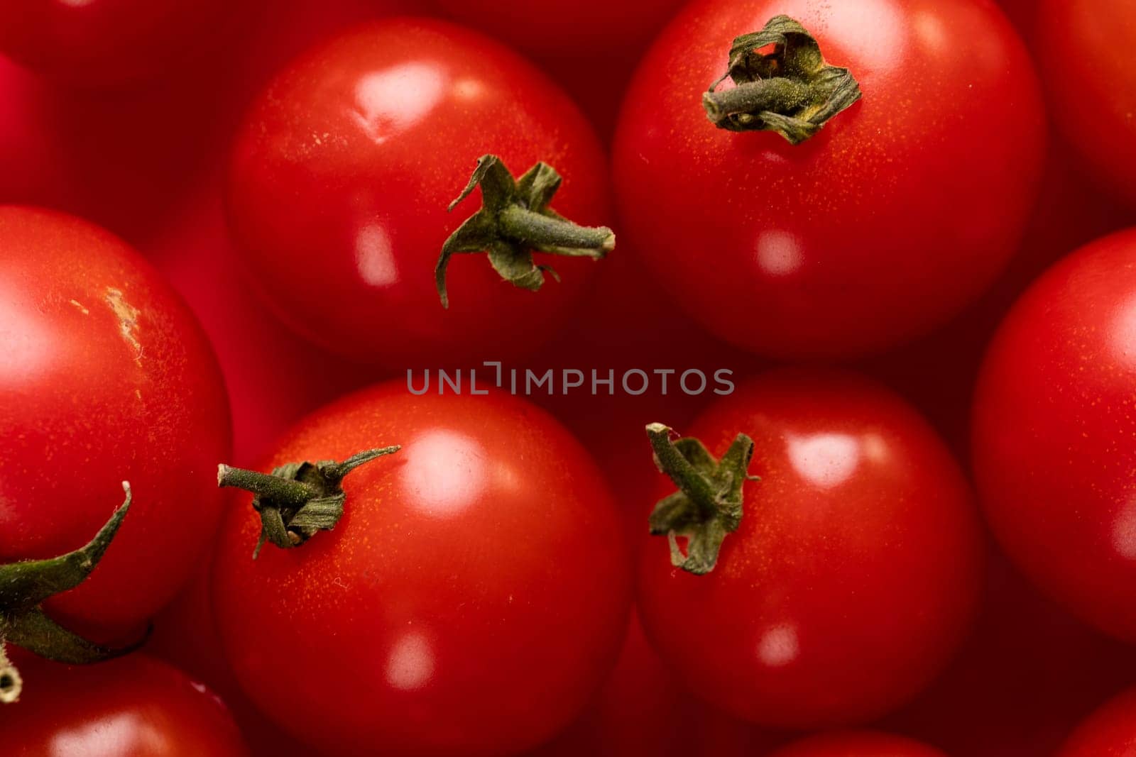 Close-up full frame shot of fresh red tomatoes heap by Wavebreakmedia