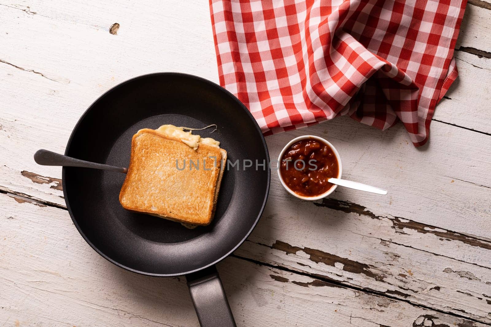 Directly above view of fresh cheese sandwich in cooking pan by dip on white wooden table. unaltered, food, unhealthy eating and snack concept.