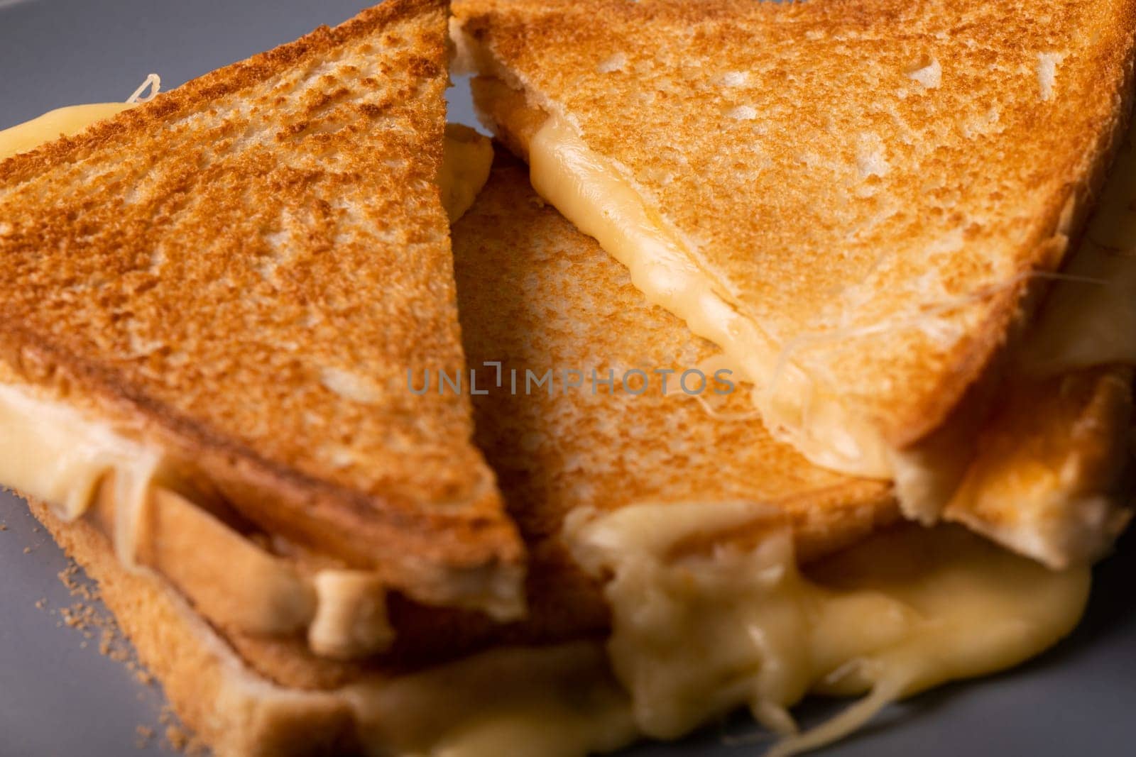 High angle close-up view of fresh cheese toast sandwich stack by Wavebreakmedia