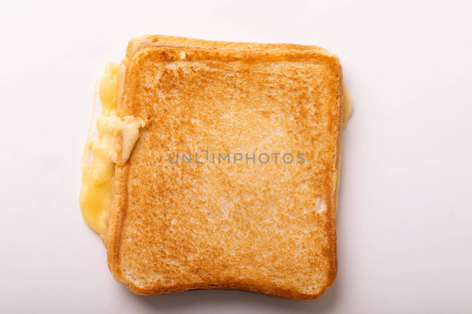 Directly above view of fresh cheese toast sandwich over white background. unaltered, food, unhealthy eating and snack concept.