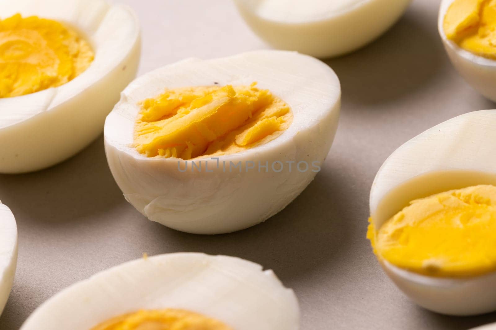 High angle view of fresh white boiled eggs on gray table by Wavebreakmedia