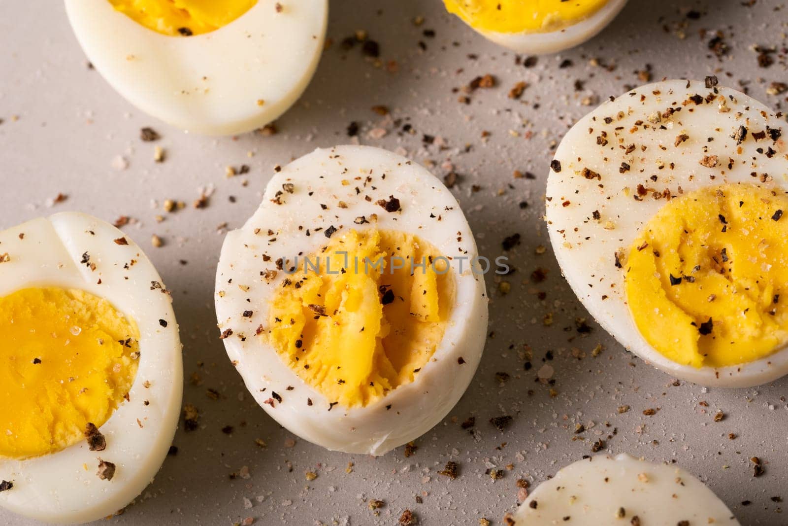 Directly above view of fresh boiled white eggs with peppercorn seasoning. unaltered, food, healthy eating and organic concept.