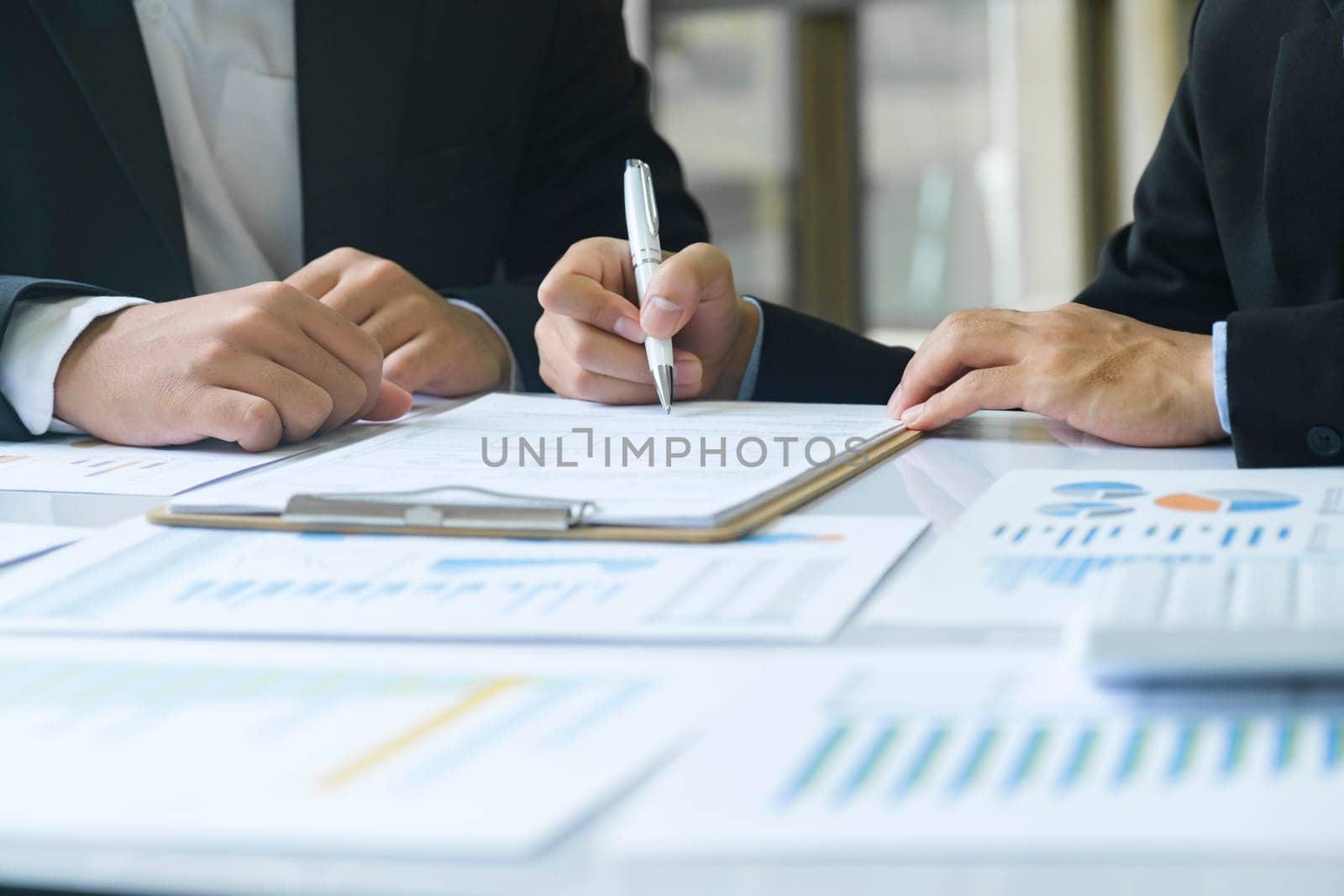 Business man sign a contract investment professional document agreement, ready signing profitable offer agreement after checking contract terms of conditions, executive manager involved in legal paperwork.