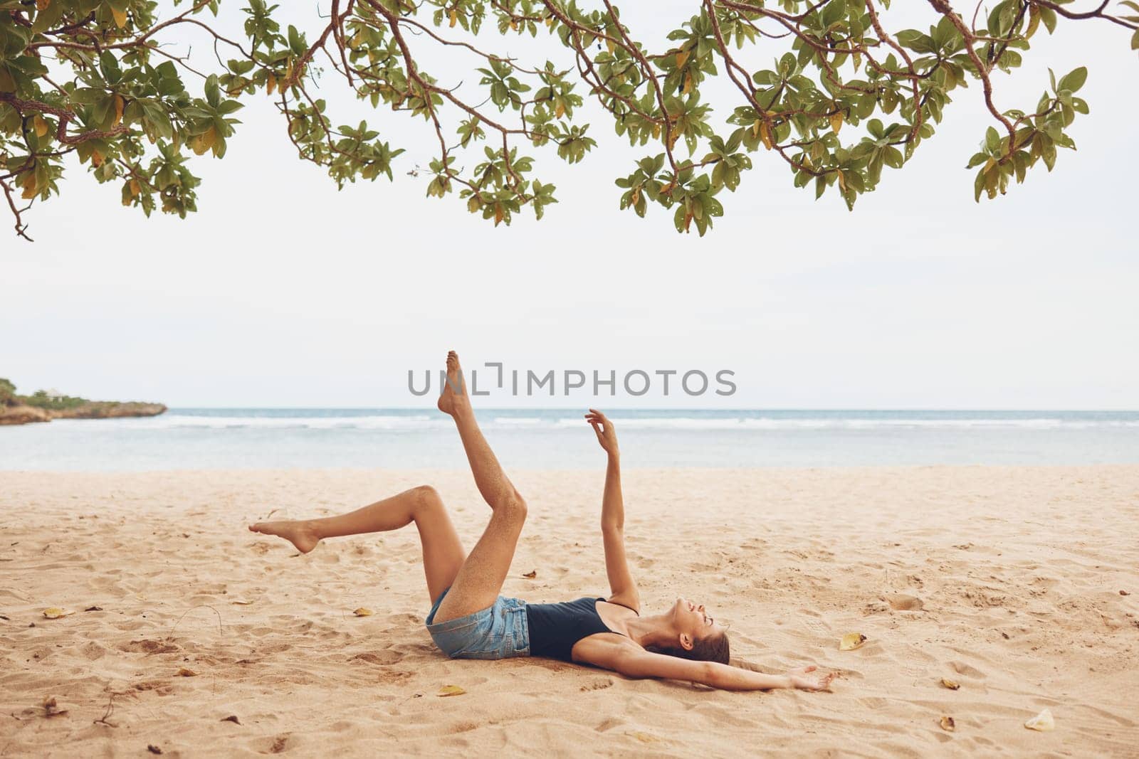 nature woman sea sitting freedom travel vacation smile sand beach carefree by SHOTPRIME