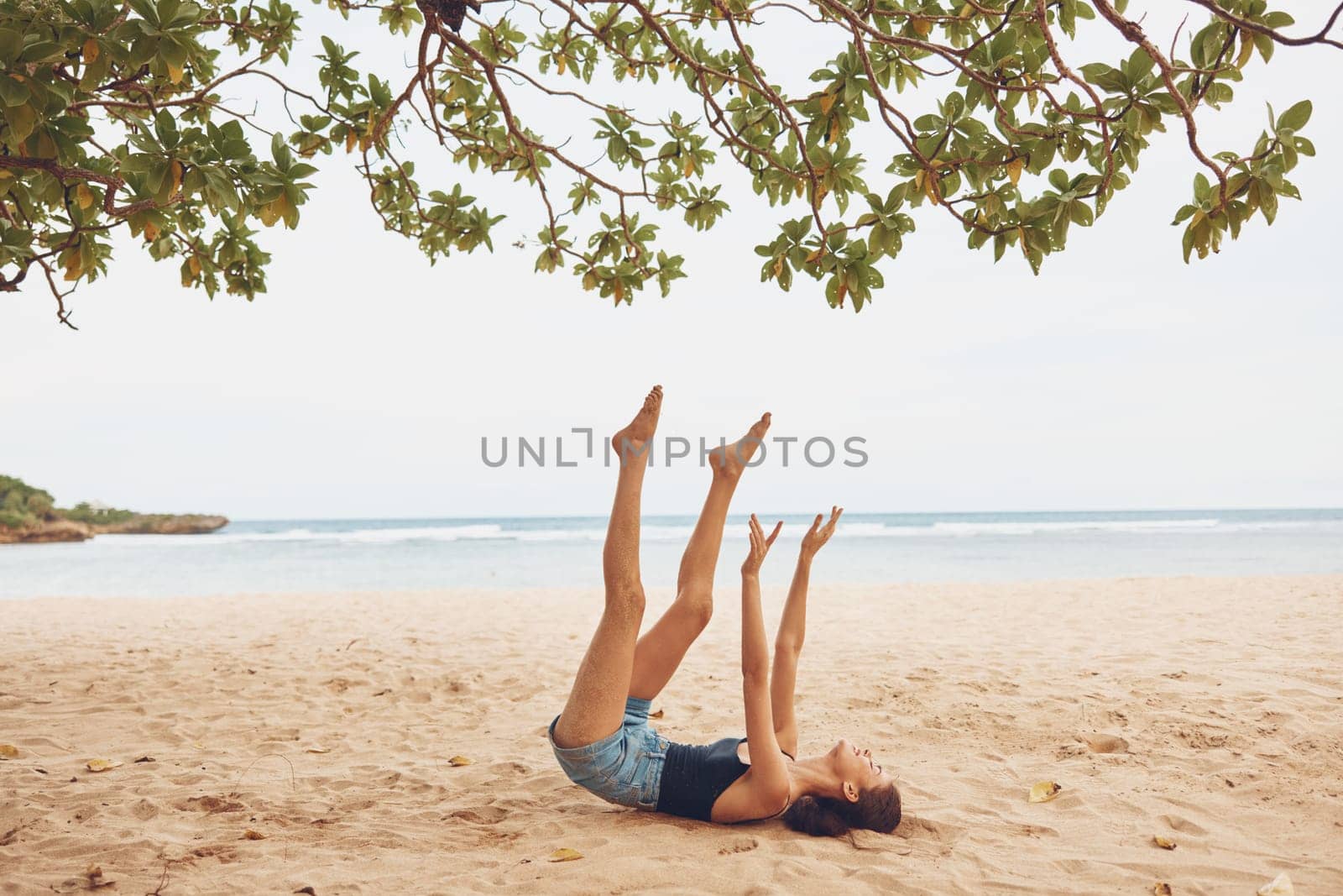 woman beach sand smile sitting vacation travel sea freedom nature ocean by SHOTPRIME