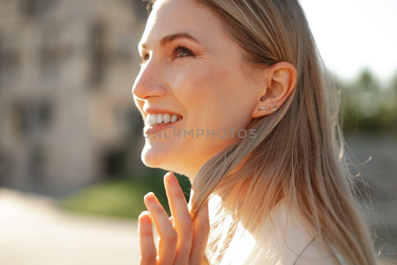 Close up portrait of young blonde businesswoman outdoors