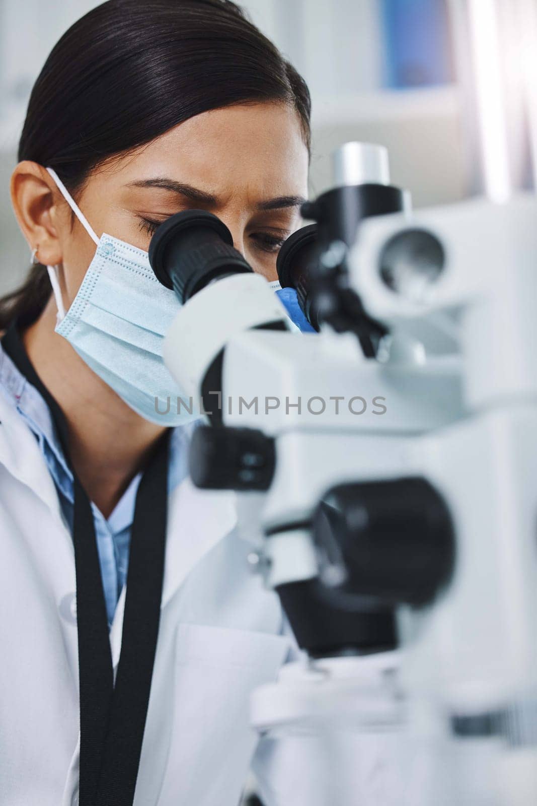 Science, laboratory and woman with microscope for medical analysis, research and lab test. Healthcare, biotechnology and female scientists with equipment for sample, experiment and examine virus.
