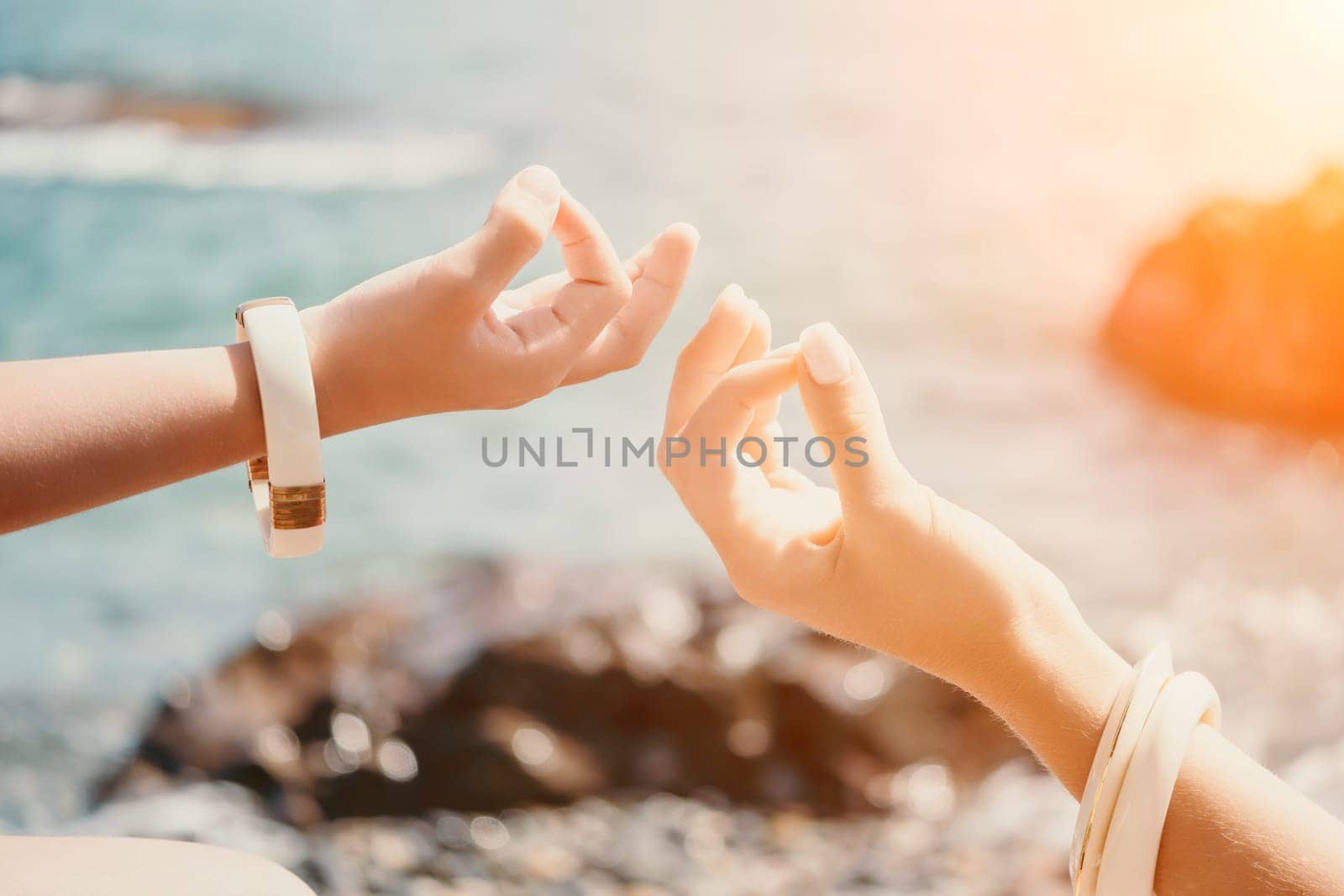Close up Hand Gesture of Woman Doing an Outdoor Lotus Yoga Position. Close up. Blurred background