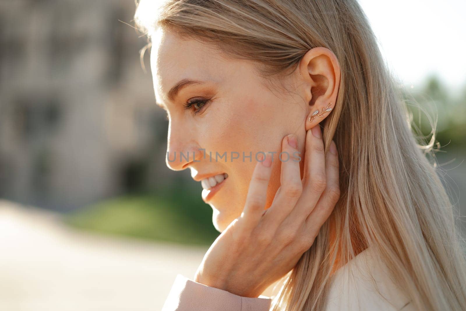 Close up portrait of young blonde businesswoman outdoors