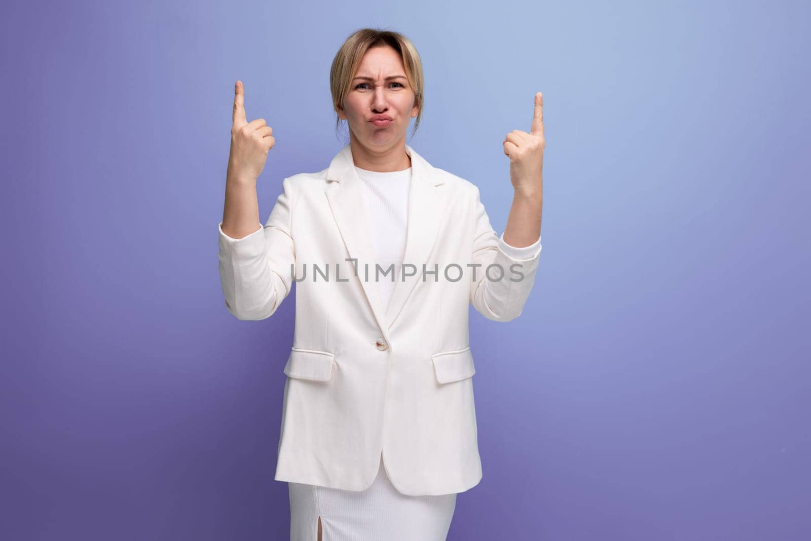 smart young blond office woman in a white jacket reports a working idea.