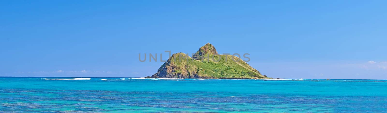 Blue water, tropical island travel and Hawaii with clear sky in summer in nature on holiday. Natural background, sunshine and sunrise at the ocean and beach of Oahu outdoor with sea and mockup space by YuriArcurs