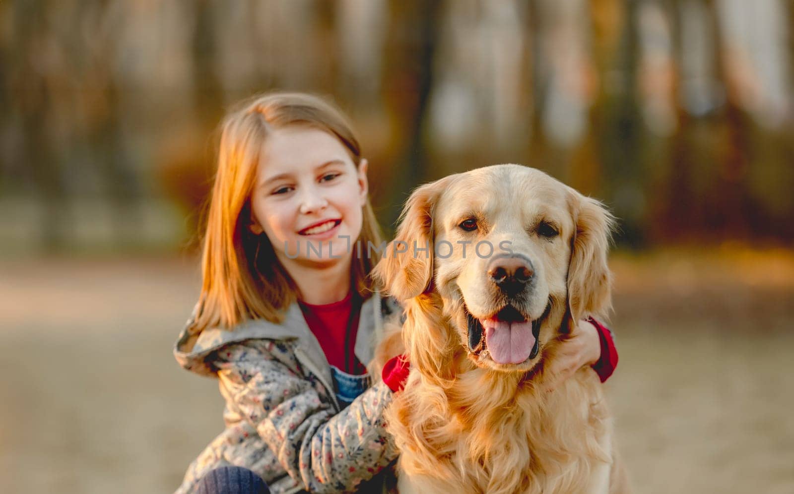 Preteen girl with golden retriever dog by tan4ikk1