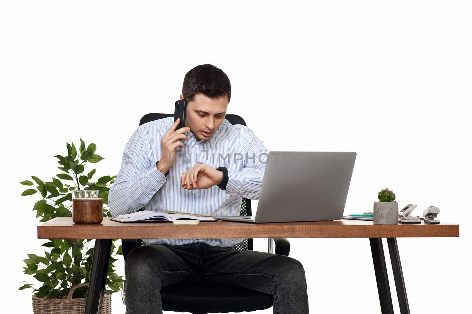 businessman working with laptop and having phone conversation by erstudio