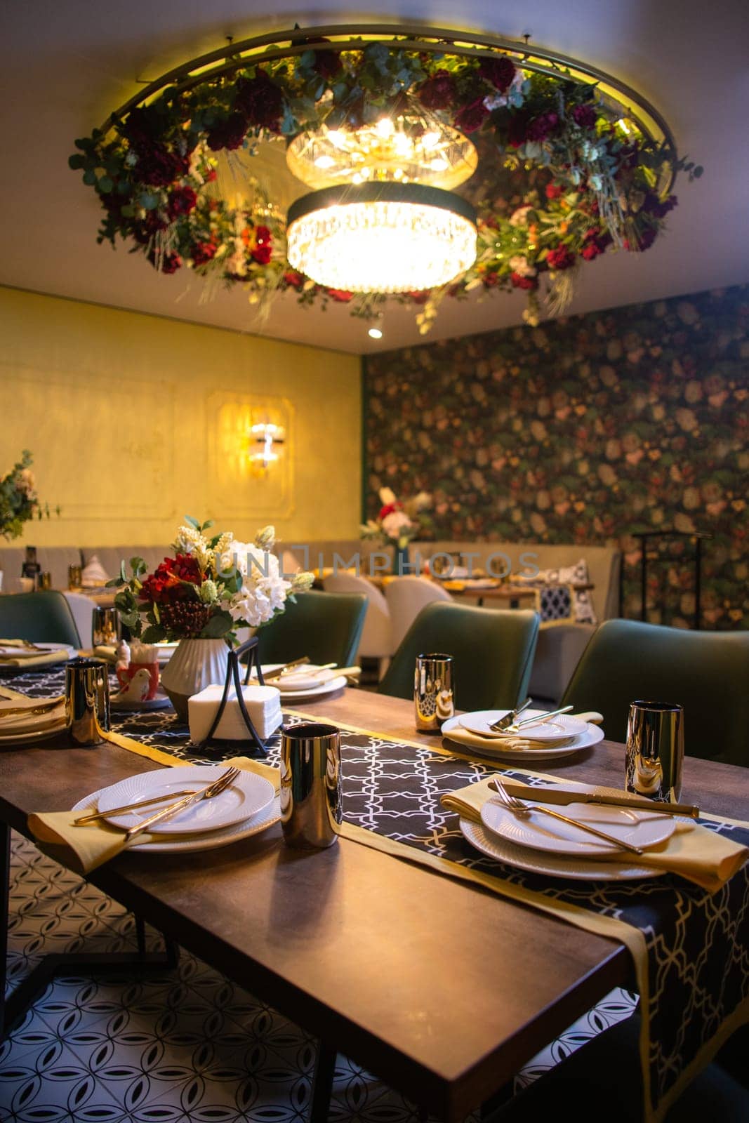 the interior of the restaurant room in the evening.