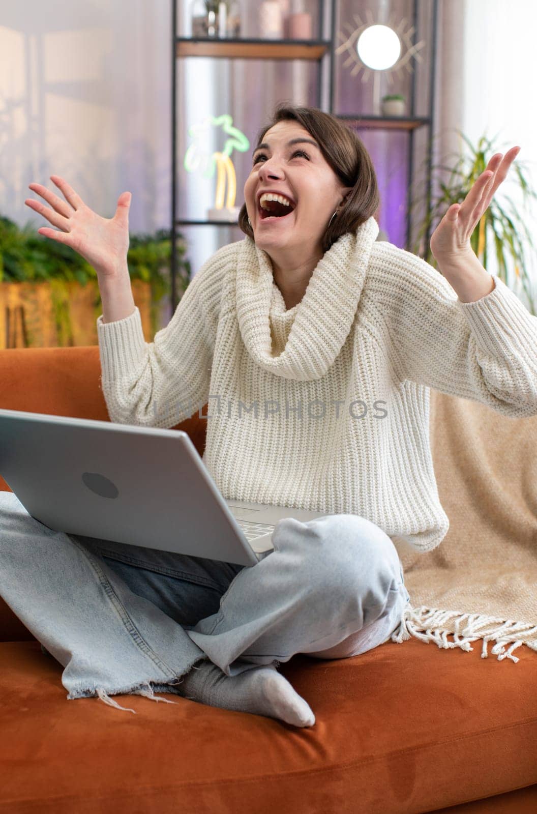 Oh my God Wow. Surprised young woman using laptop computer, receive good news message, shocked by sudden victory celebrate lottery jackpot win purchases online shopping at home. Lifestyle technologies