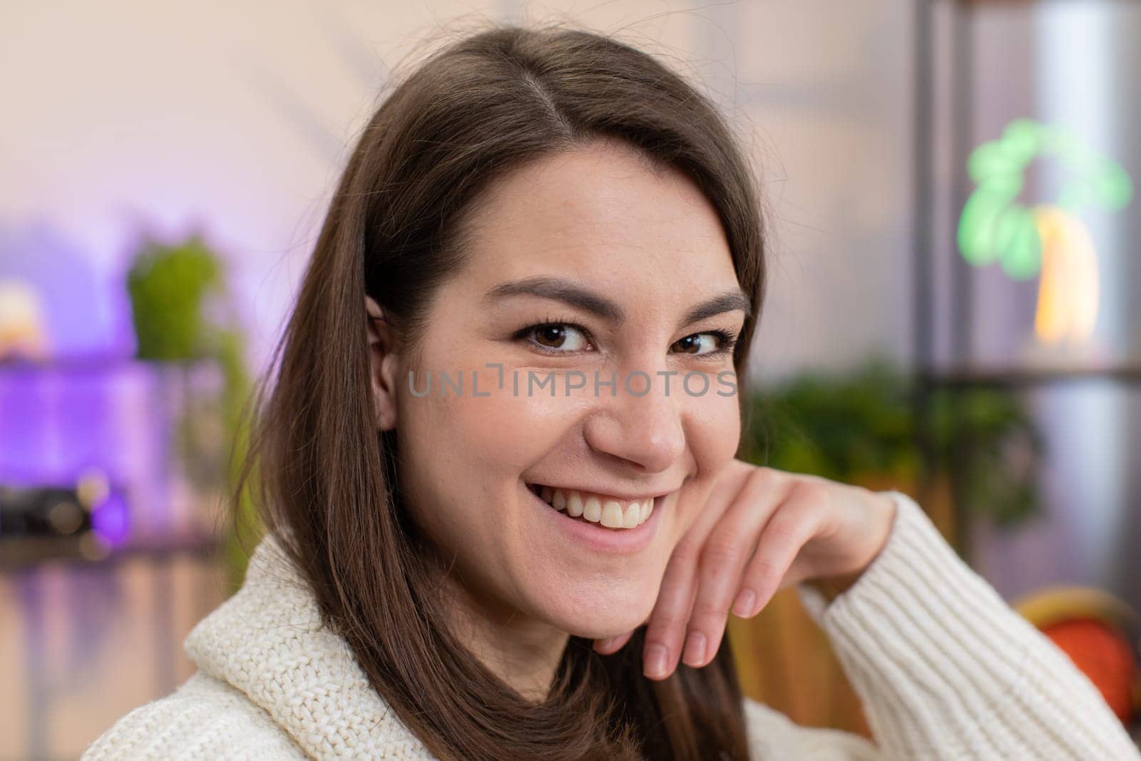 Portrait of happy calm young woman at home couch smiling friendly, glad expression looking away dreaming resting, relaxation feel satisfied concept good news, celebrate win. Girl on living room sofa