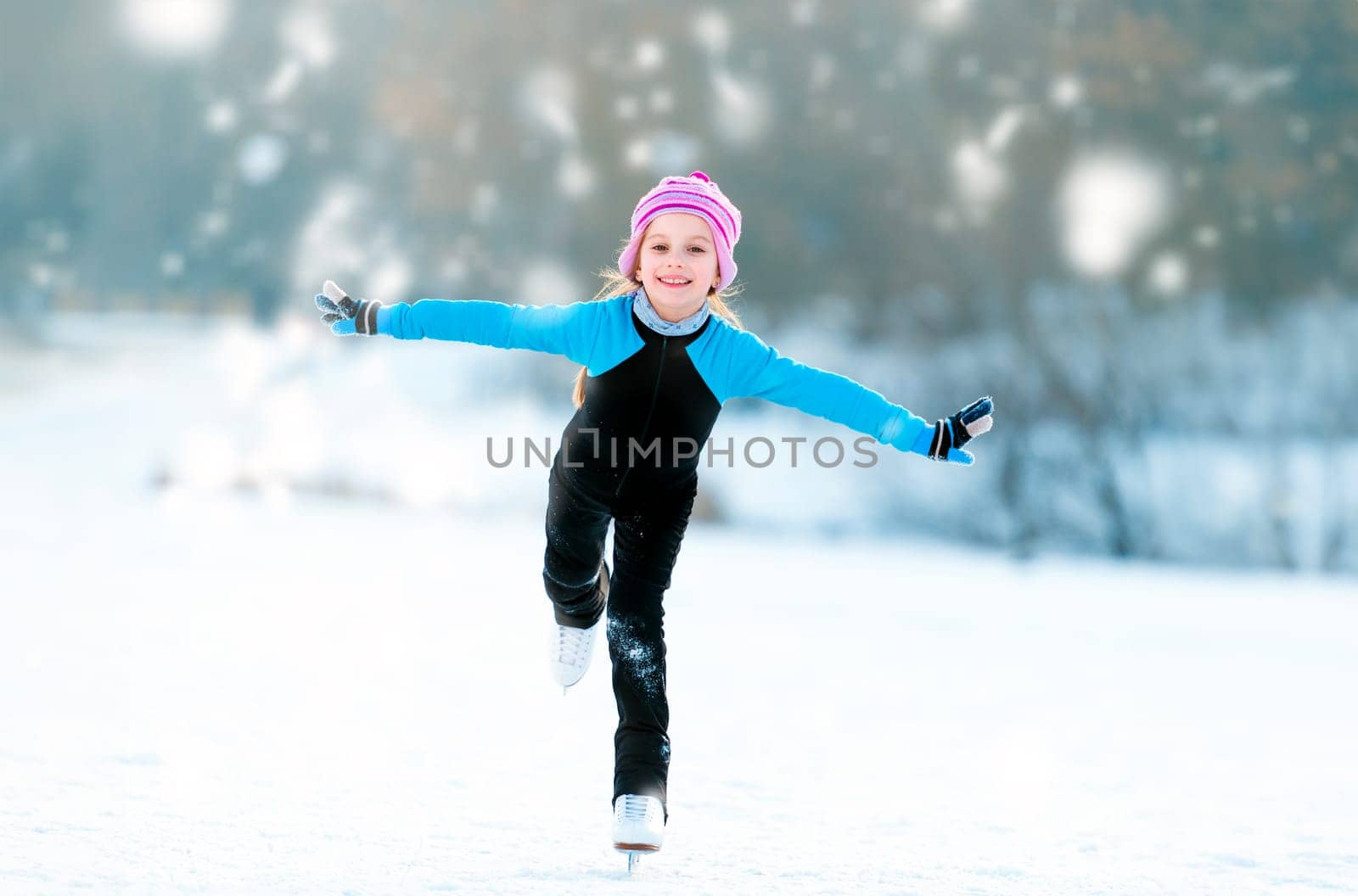 happy cute little girl in thermal suits skating