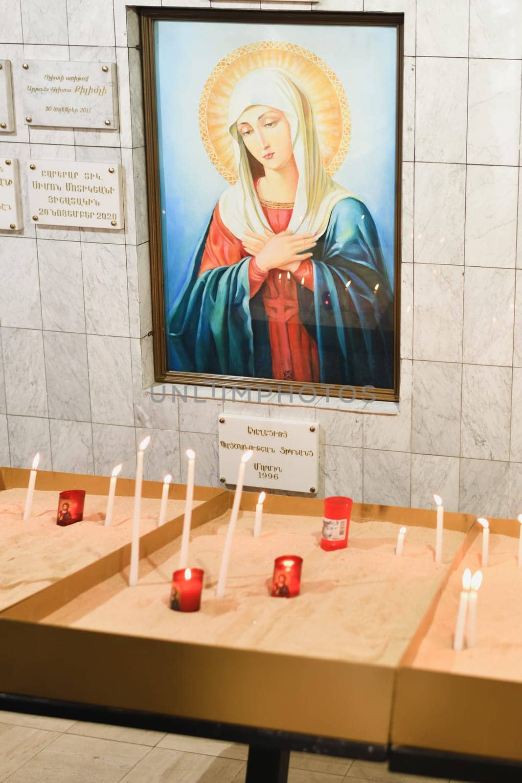 PARIS, FRANCE - SEPTEMBER 03, 2022: Armenian Apostolic Church of Saint Marie mere de Dieu in Paris candles for peace