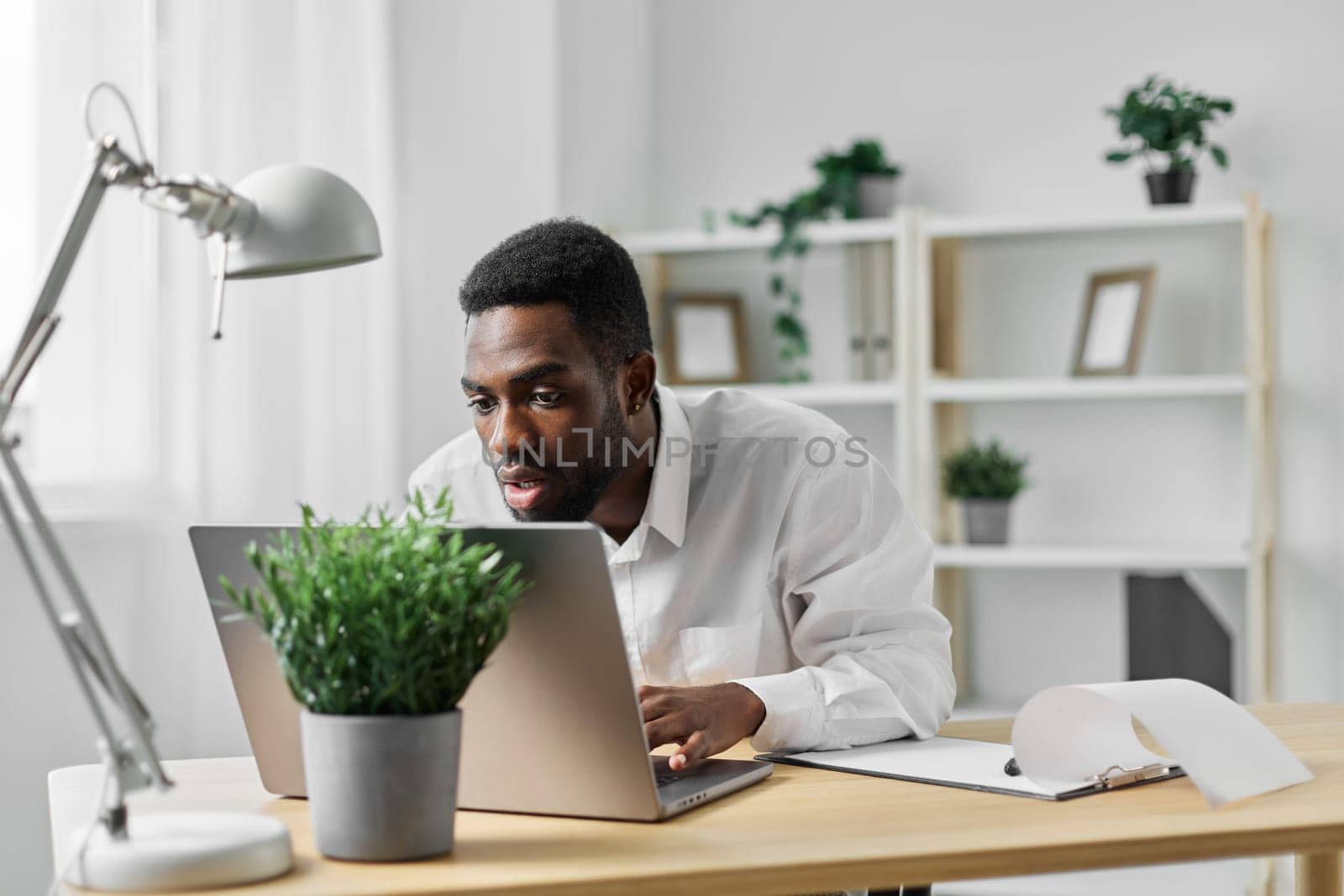 man space businessman african black african education american conference freelance freelancer employee laptop office computer workplace job online table student business distance blank